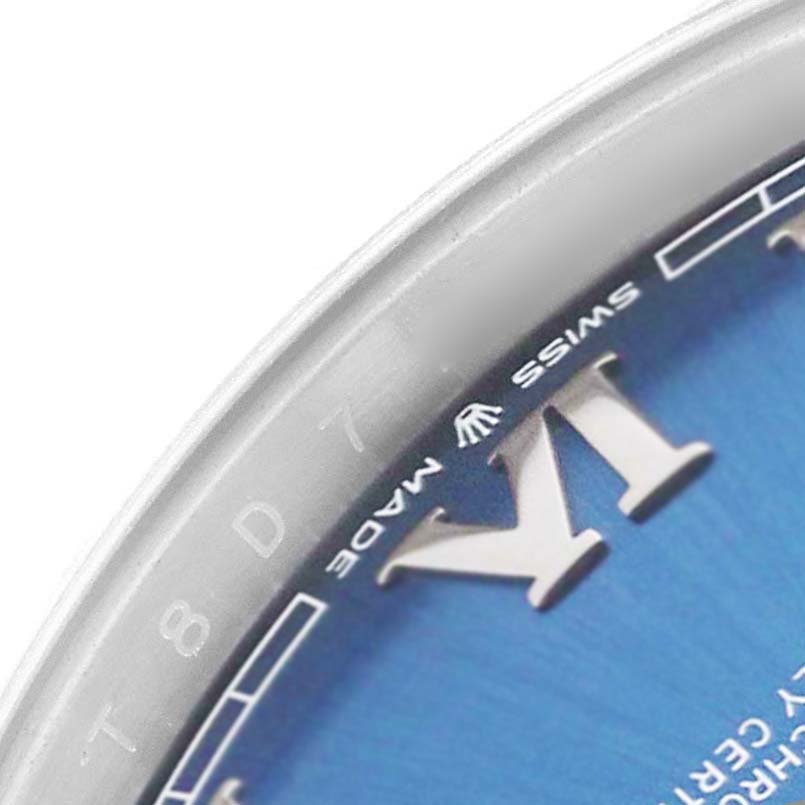 The image shows a close-up angle of the Rolex Datejust 41 126300 Men's Stainless Steel Blue Dial, focusing on part of the blue dial, Roman numeral, and "Swiss Made" text.