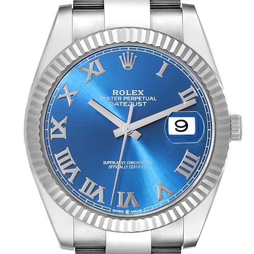 The image shows a Rolex Datejust 41 126334 Men's Stainless Steel Grey Dial watch from a front angle, highlighting the blue dial, Roman numerals, fluted bezel, and cyclops date window.