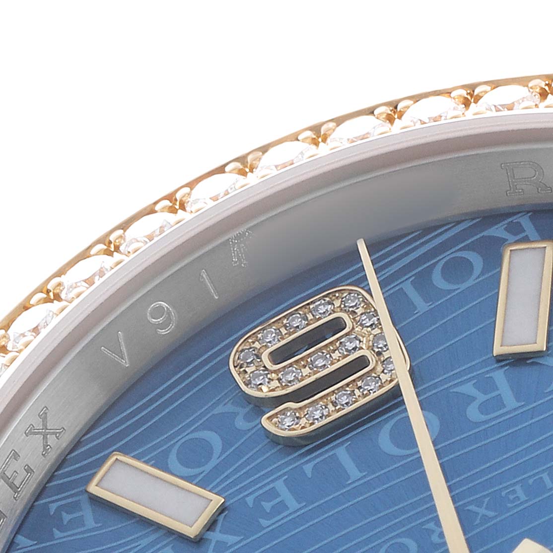 The image shows a close-up of the Rolex Datejust 116243 Men's Steel and Gold (two tone) Blue Dial's blue dial, gold and diamond numeral, and part of the diamond bezel.