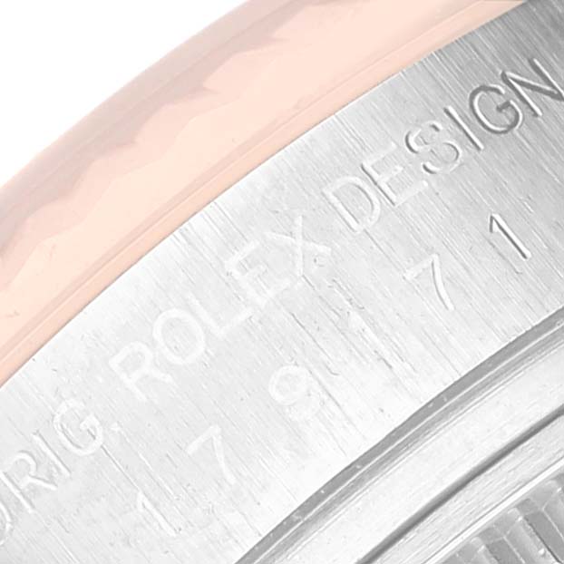 This image shows an angled view of the engraved side of the Rolex Datejust 179171 Women's Steel and Gold (two tone) Black Dial 179171 Women's Steel and Gold (two tone) Black Dial watch case.