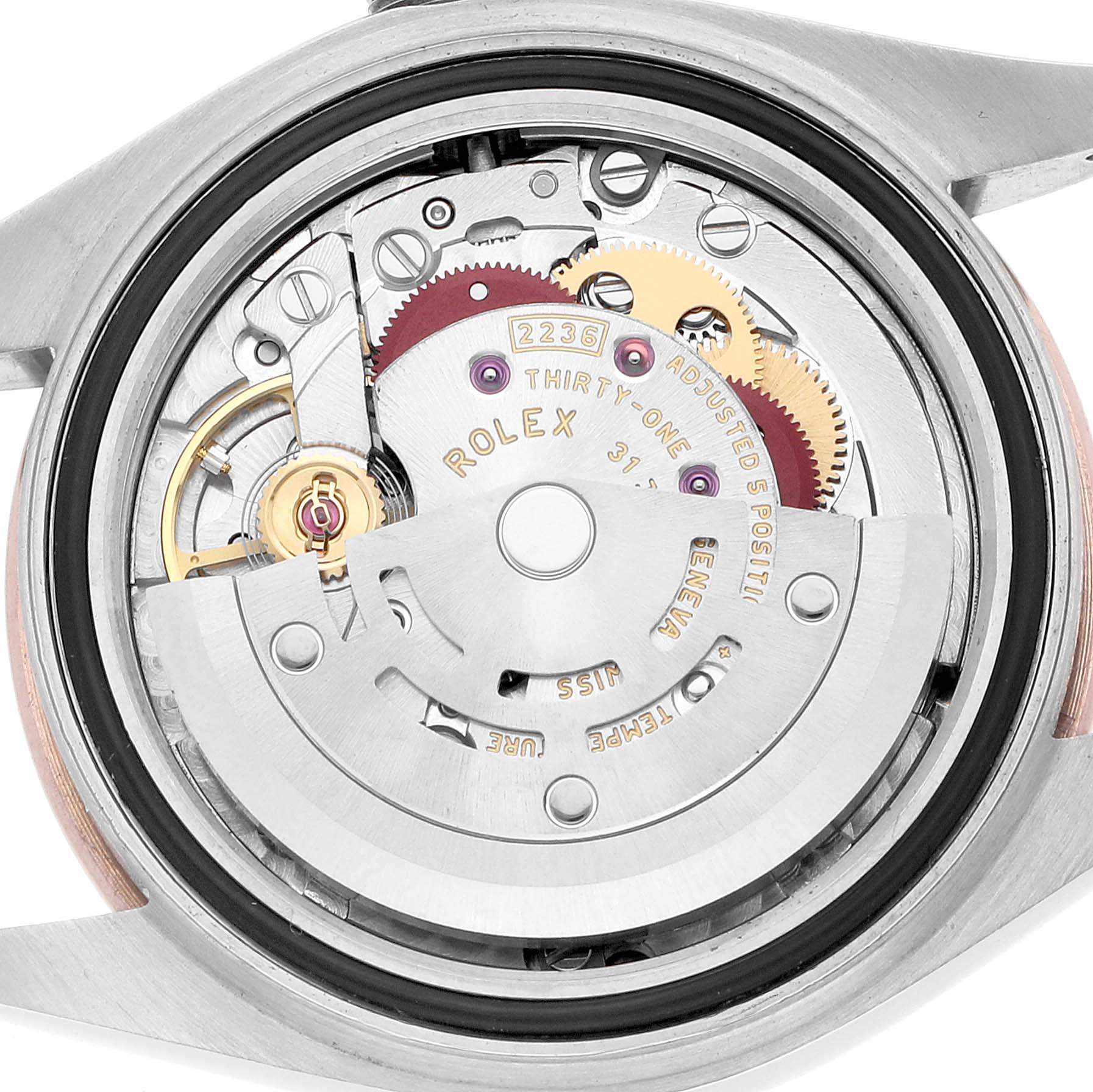 The image shows the movement mechanism of a Rolex Datejust 279161 Women's Steel and Gold (two tone) Silver Dial watch from the back, highlighting gears and the rotor.