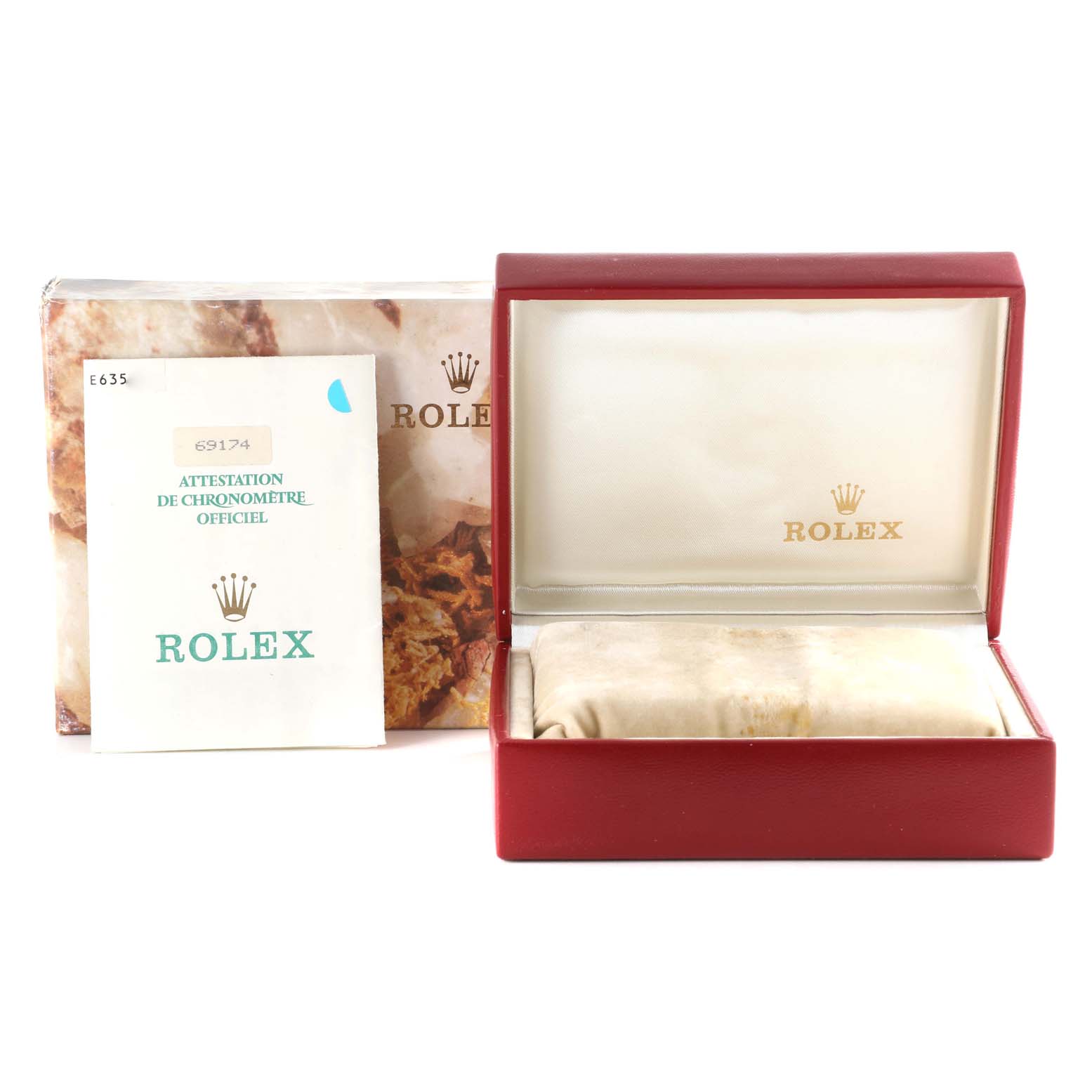 The image shows the packaging, instruction manual, and velvet pillow inside the box for a Rolex Datejust 69174 Women's Stainless Steel Black Dial 69174 Women's Stainless Steel Black Dial watch.