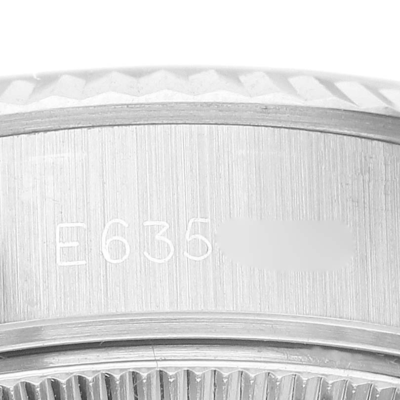 This image shows a close-up of the serial number engraved on the case of a Rolex Datejust 69174 Women's Stainless Steel Black Dial 69174 Women's Stainless Steel Black Dial watch.
