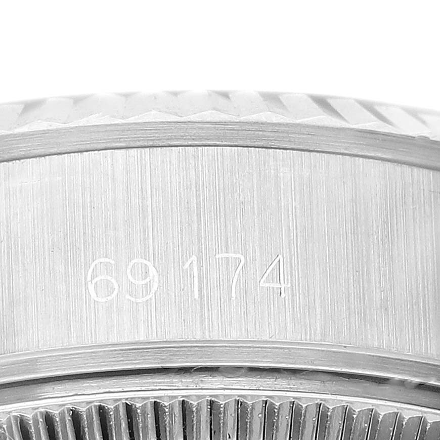 This image shows a close-up of the case side and reference number of a Rolex Datejust 69174 Women's Stainless Steel Black Dial 69174 Women's Stainless Steel Black Dial watch.