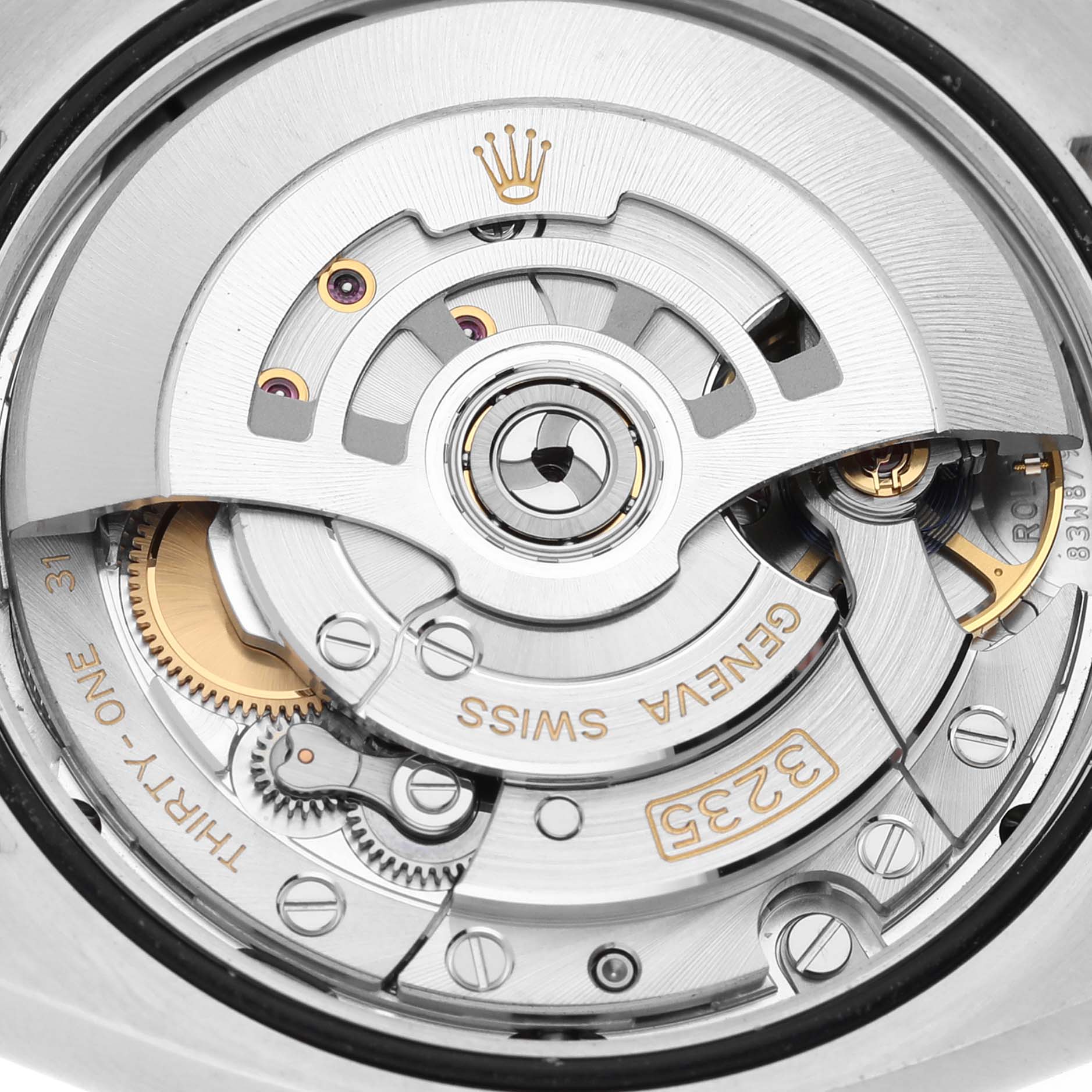 Close-up of the movement and rotor mechanism of a Rolex Datejust 126283 Men's Steel and Gold (two tone) Silver Dial 126283 Men's Steel and Gold (two tone) Silver Dial watch, showcasing intricate Swiss engineering.