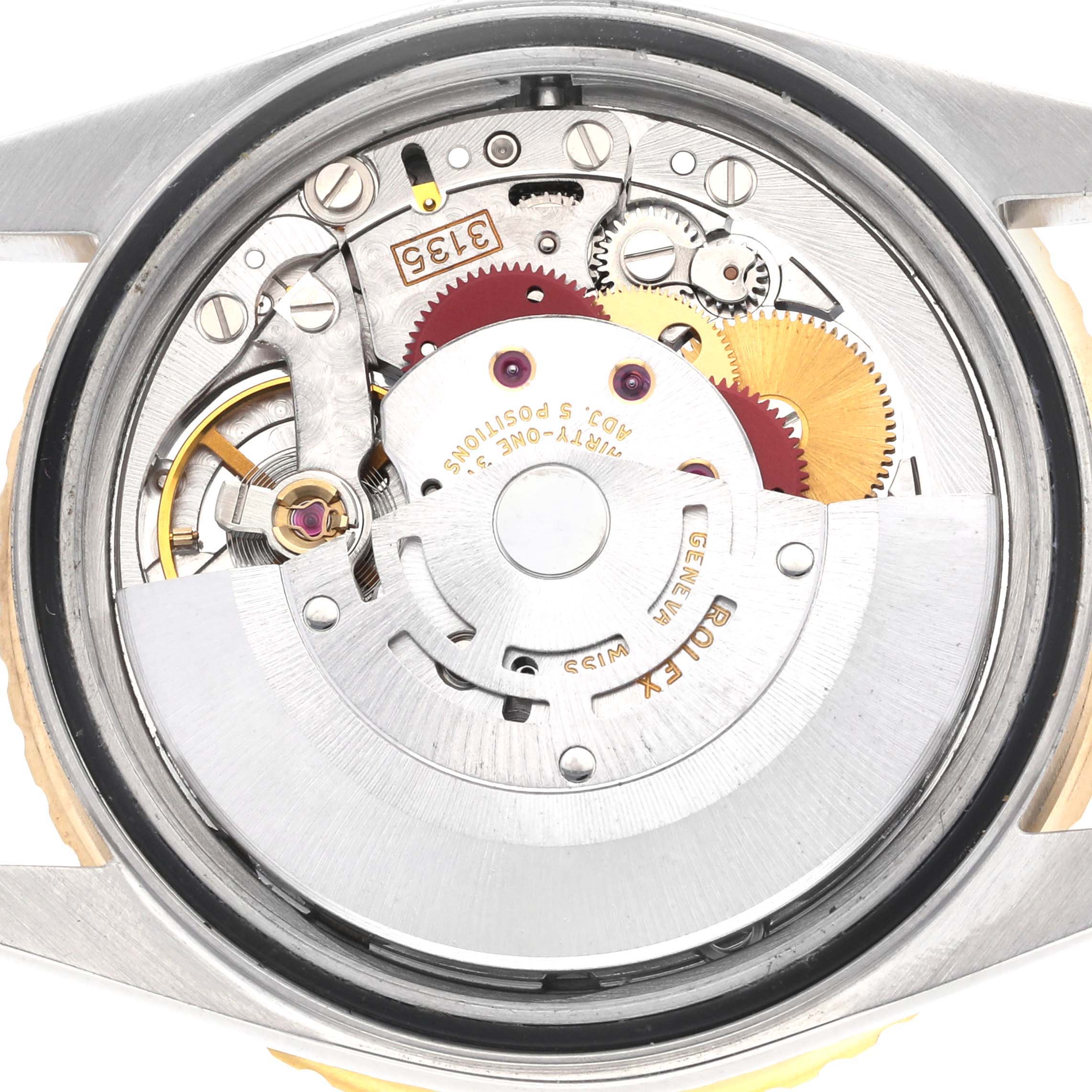 This image shows a close-up of the movement of a Rolex Turn-o-Graph 16263 Men's Steel and Gold (two tone) Champagne Dial watch from the back, highlighting gears and rotors.