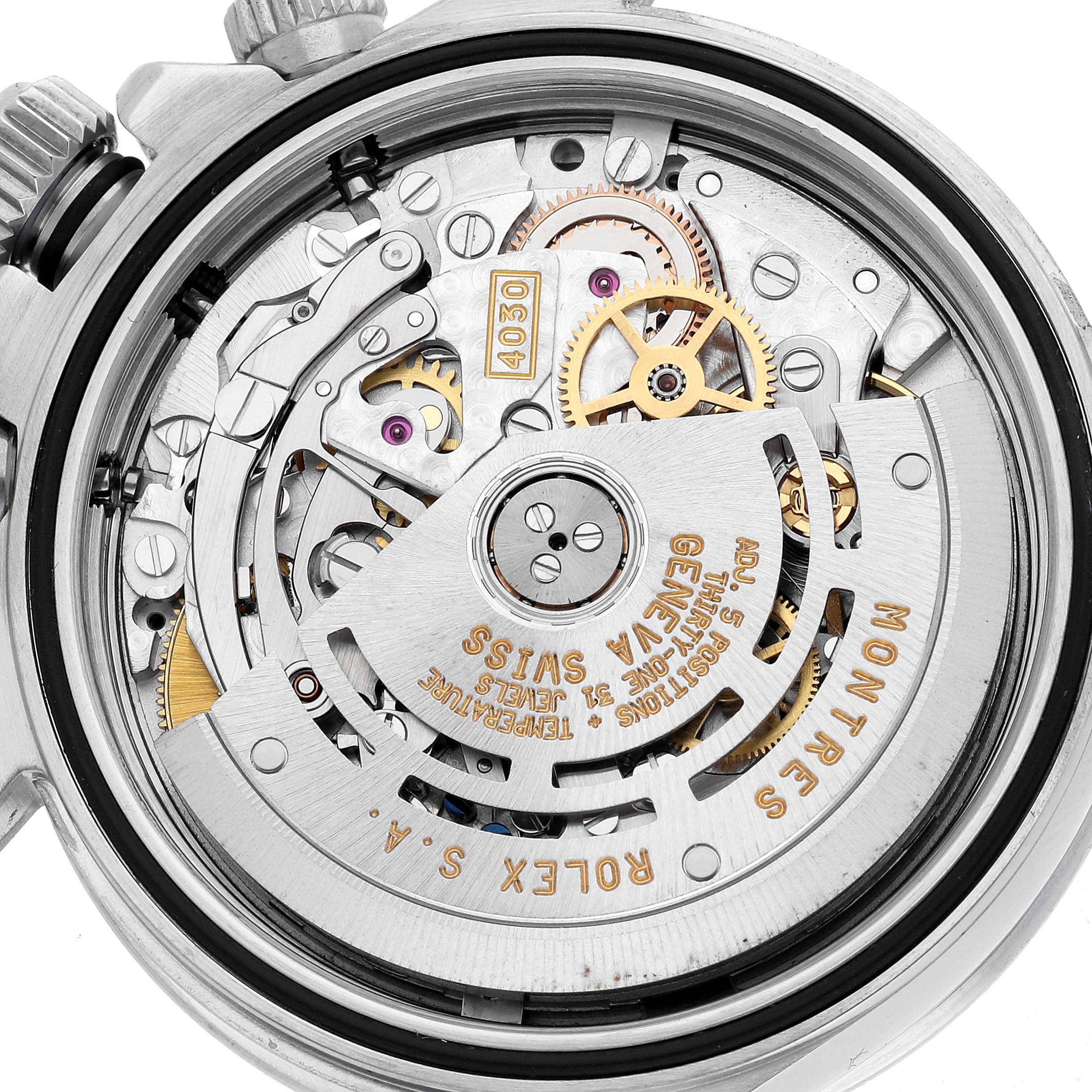 This image shows the internal mechanism of a Rolex Daytona 16520 Men's Stainless Steel White Dial watch from a rear view, highlighting the movement and gears.