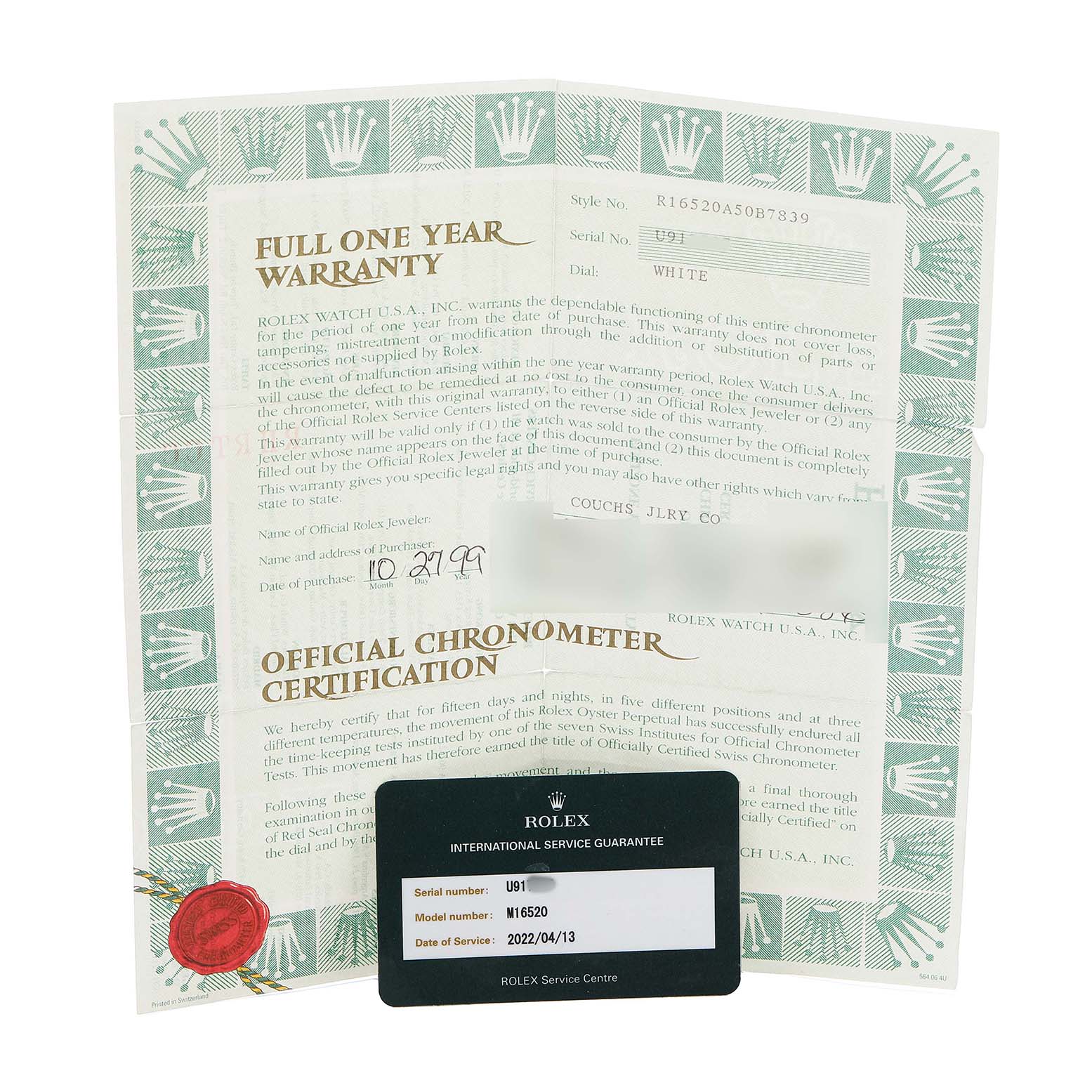 The image shows warranty and certification papers for a Rolex Daytona 16520 Men's Stainless Steel White Dial model, along with an international service guarantee card.