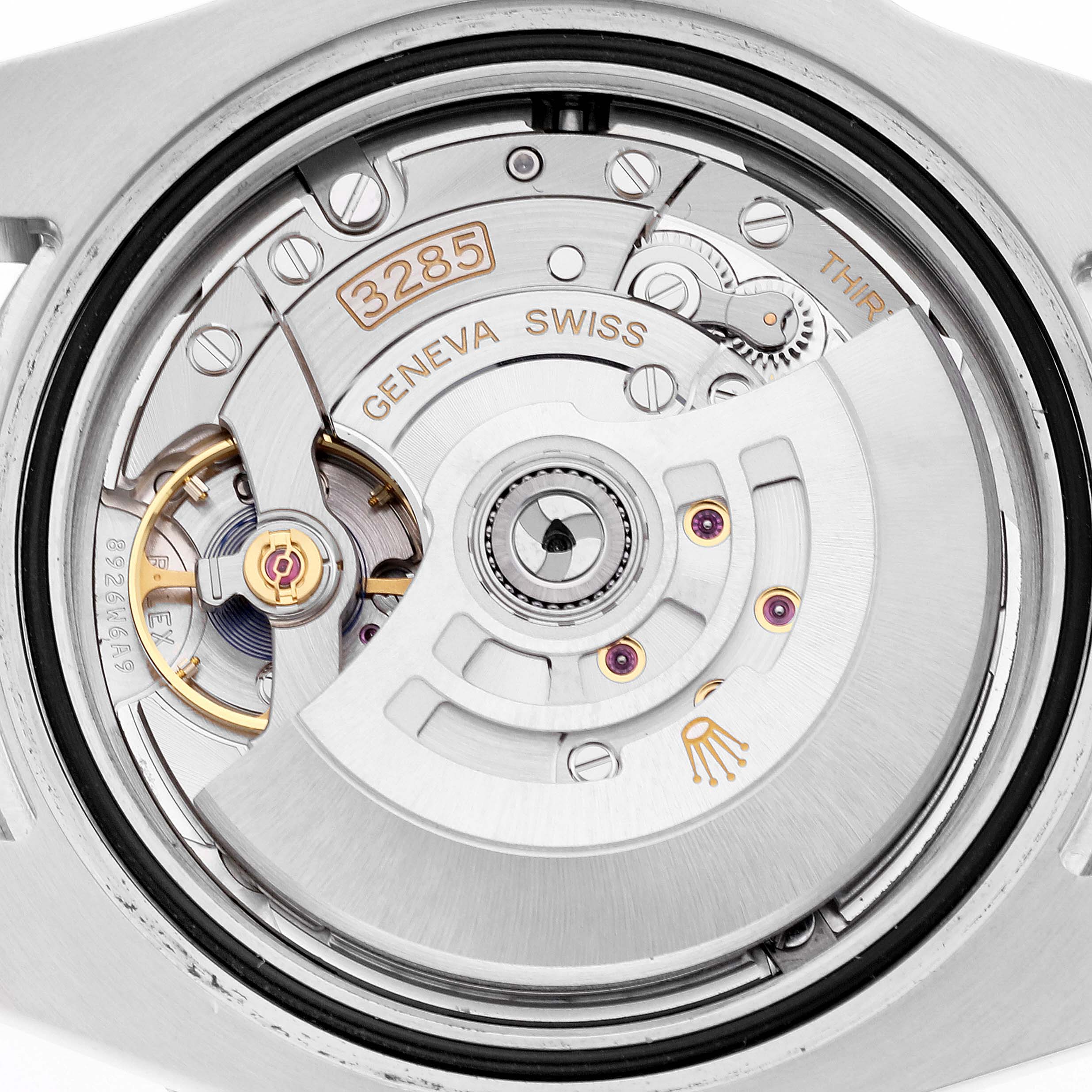 The image shows the movement mechanism of a Rolex GMT-Master 126710BLNR Men
s Stainless Steel Black Dial 126710BLNR Men
s Stainless Steel Black Dial watch from the back, highlighting its intricate parts and details.