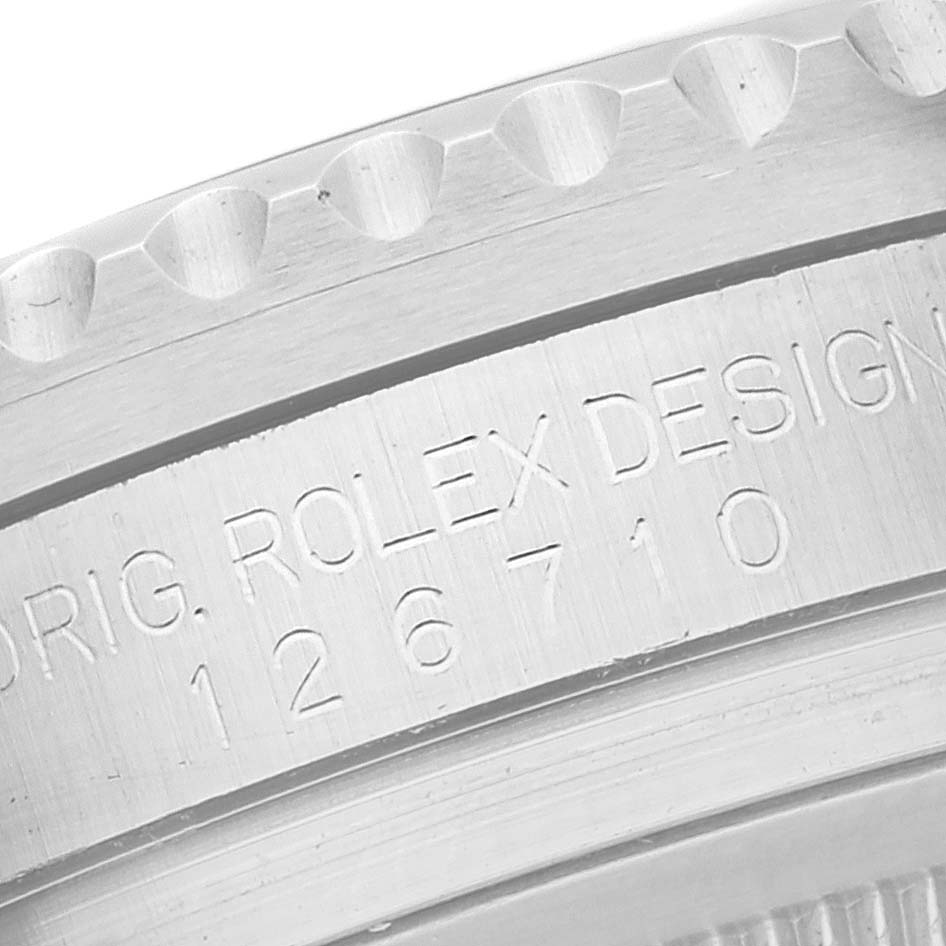 This close-up shows the engraved model number and design text on the case of a Rolex GMT-Master 126710BLNR Men
s Stainless Steel Black Dial 126710BLNR Men
s Stainless Steel Black Dial watch.