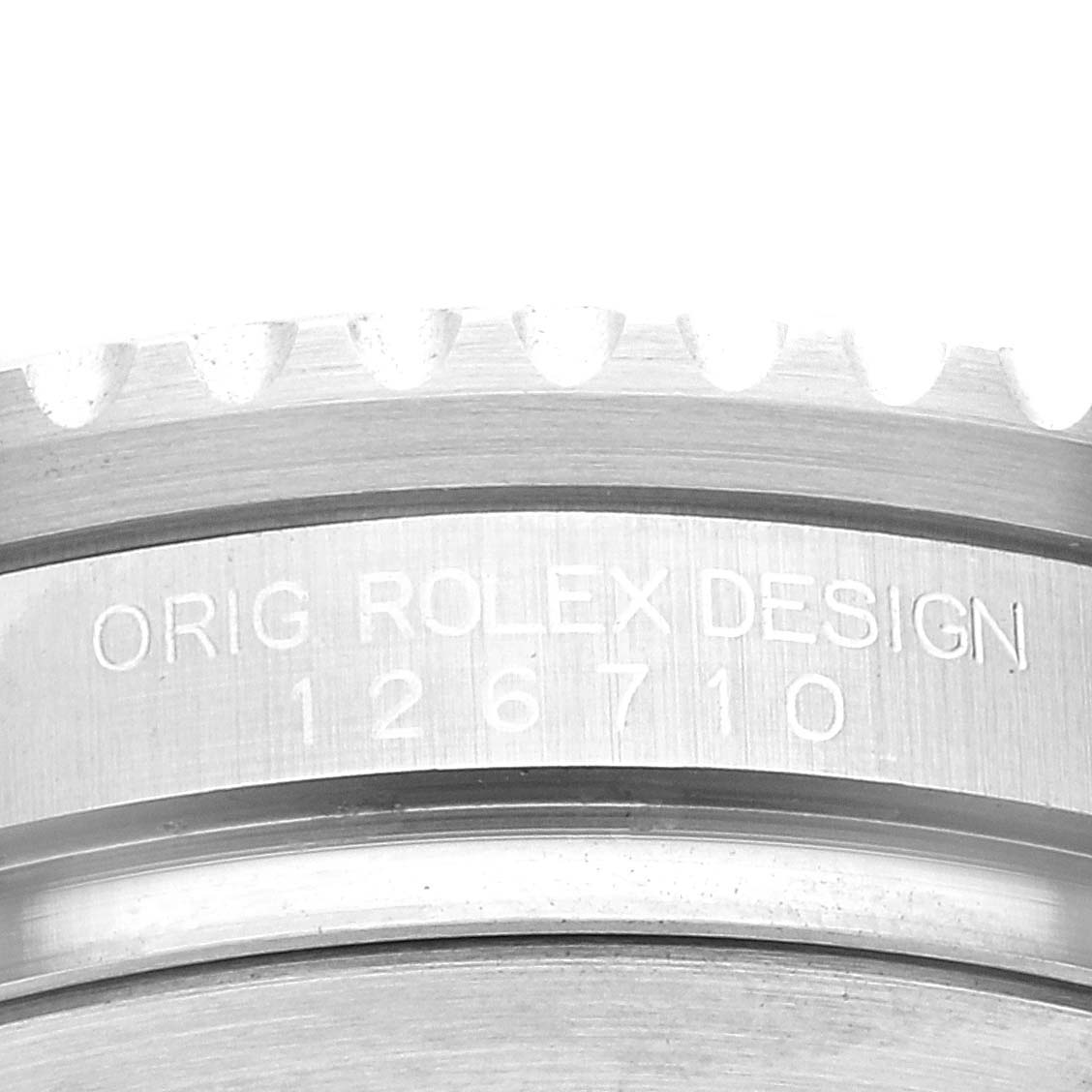 This image shows a close-up view of the side engraving on the bezel of the Rolex GMT-Master 126710 Men
s Stainless Steel Black Dial 126710 Men
s Stainless Steel Black Dial model.