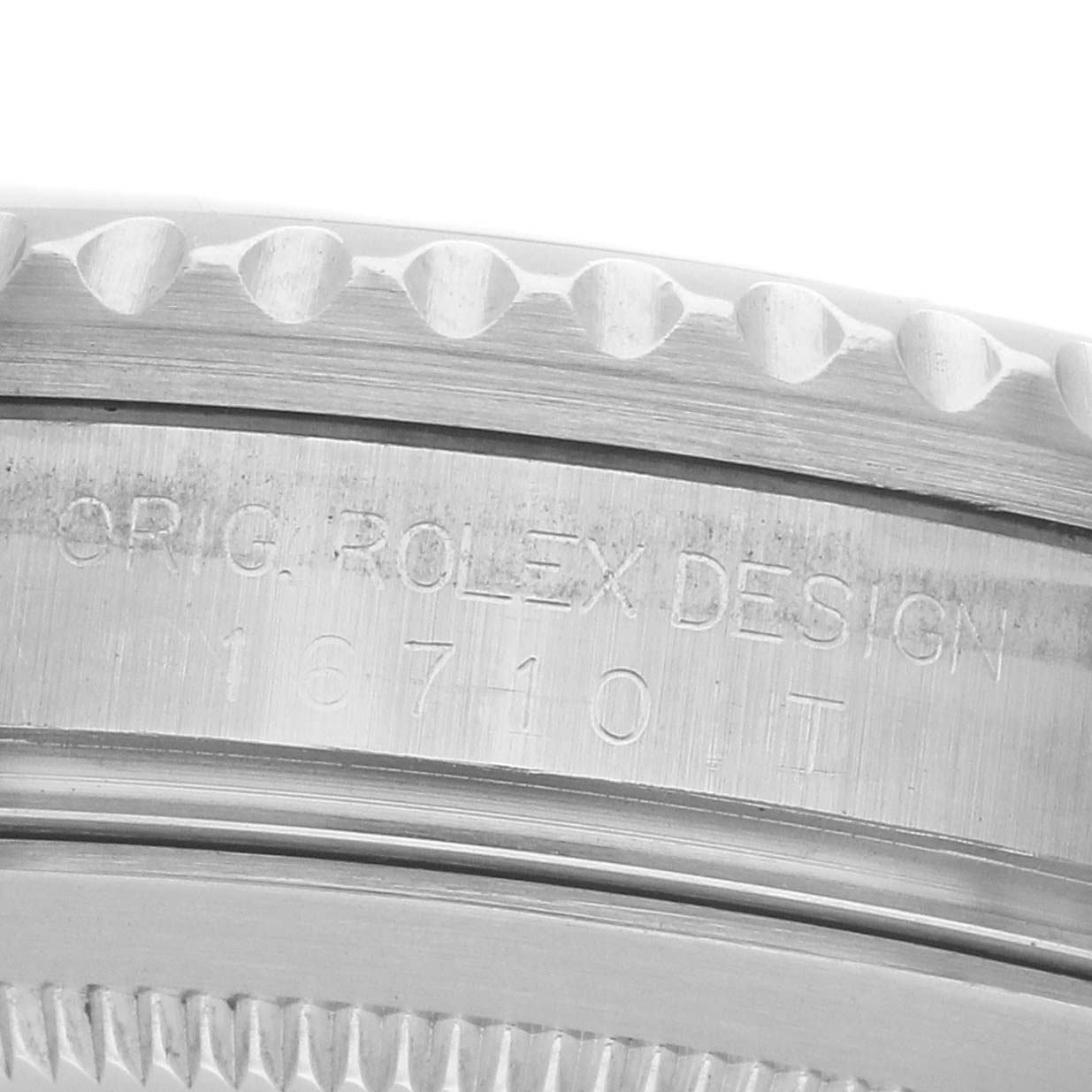 This image shows a close-up of the side of a Rolex GMT-Master 16710 Men's Stainless Steel Black Dial, highlighting the grooved bezel and model engraving.