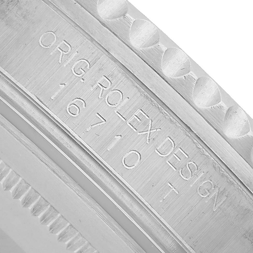 This close-up image shows the side engraving of the Rolex GMT-Master 16710 Men's Stainless Steel Black Dial model, including design details and model number.