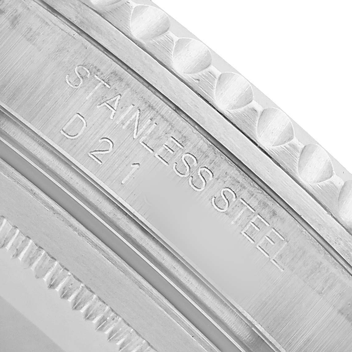The image shows a close-up of the stainless steel back with engravings of the Rolex GMT-Master 16710 Men's Stainless Steel Black Dial.
