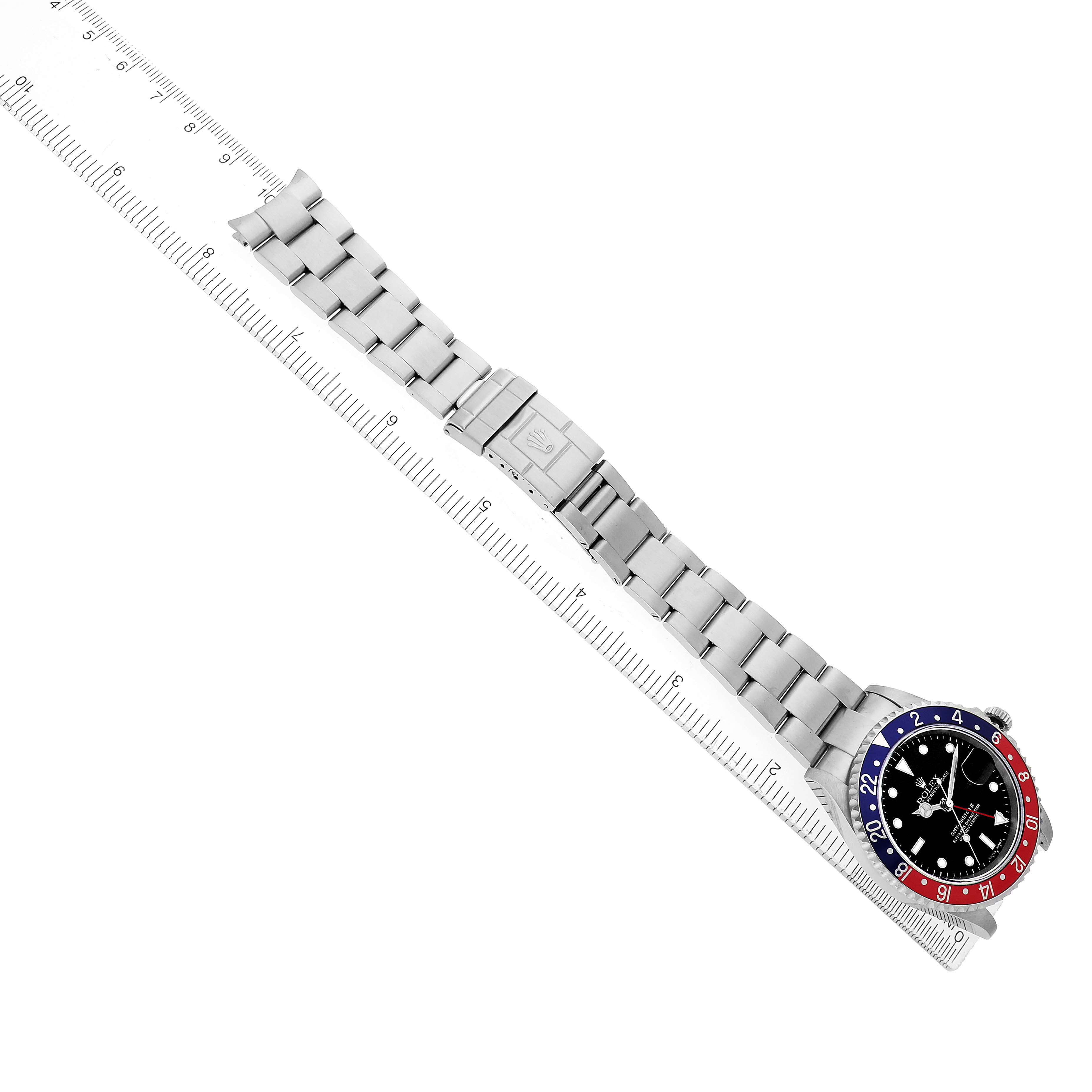 The Rolex GMT-Master 16710 Men's Stainless Steel Black Dial watch is shown from an overhead angle, displaying the full bracelet, clasp, and bezel clearly.