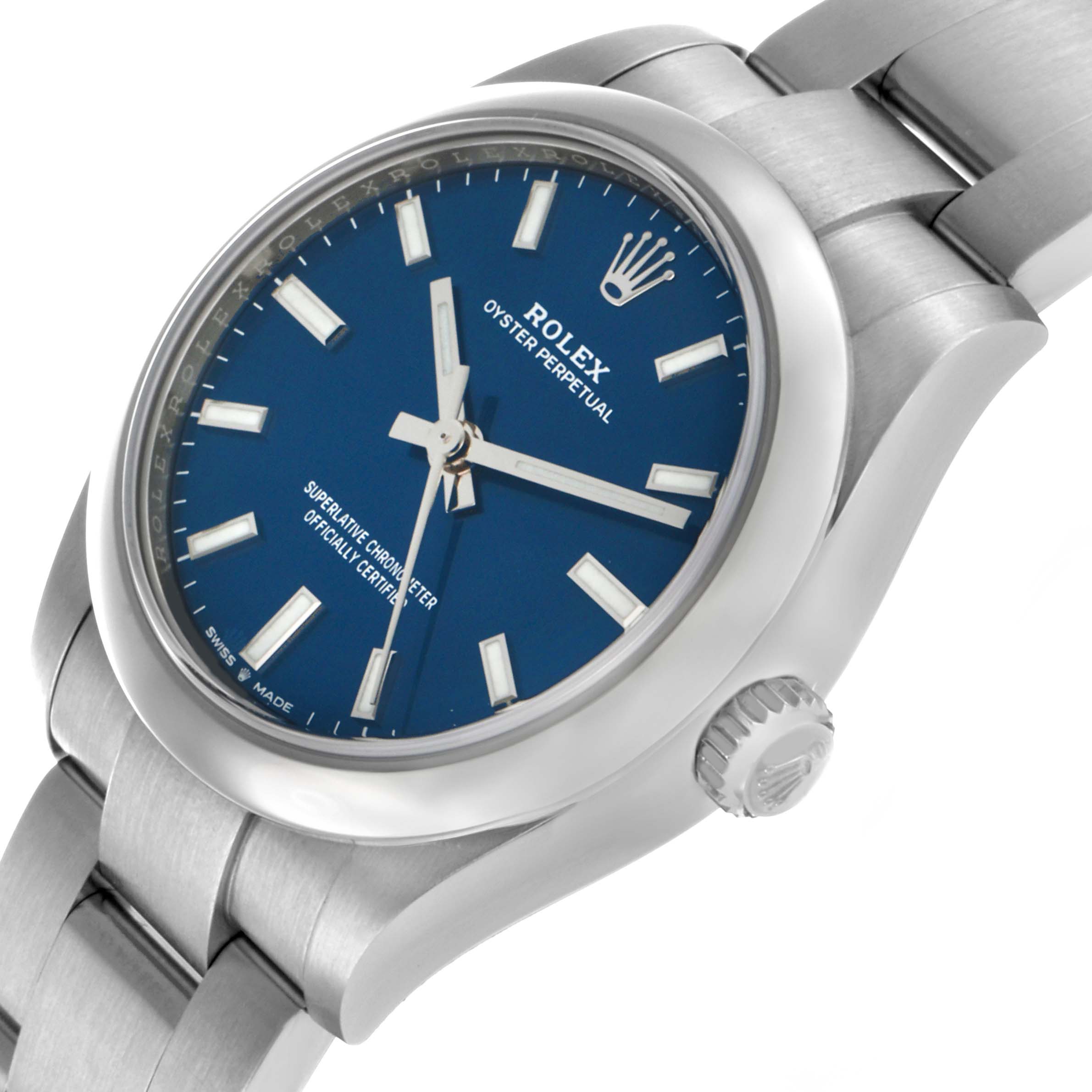 The Rolex Mid-Size 277200 Women's Stainless Steel Blue Dial model is shown at a slight angle, highlighting the blue dial, hour markers, bezel, crown, and part of the bracelet.