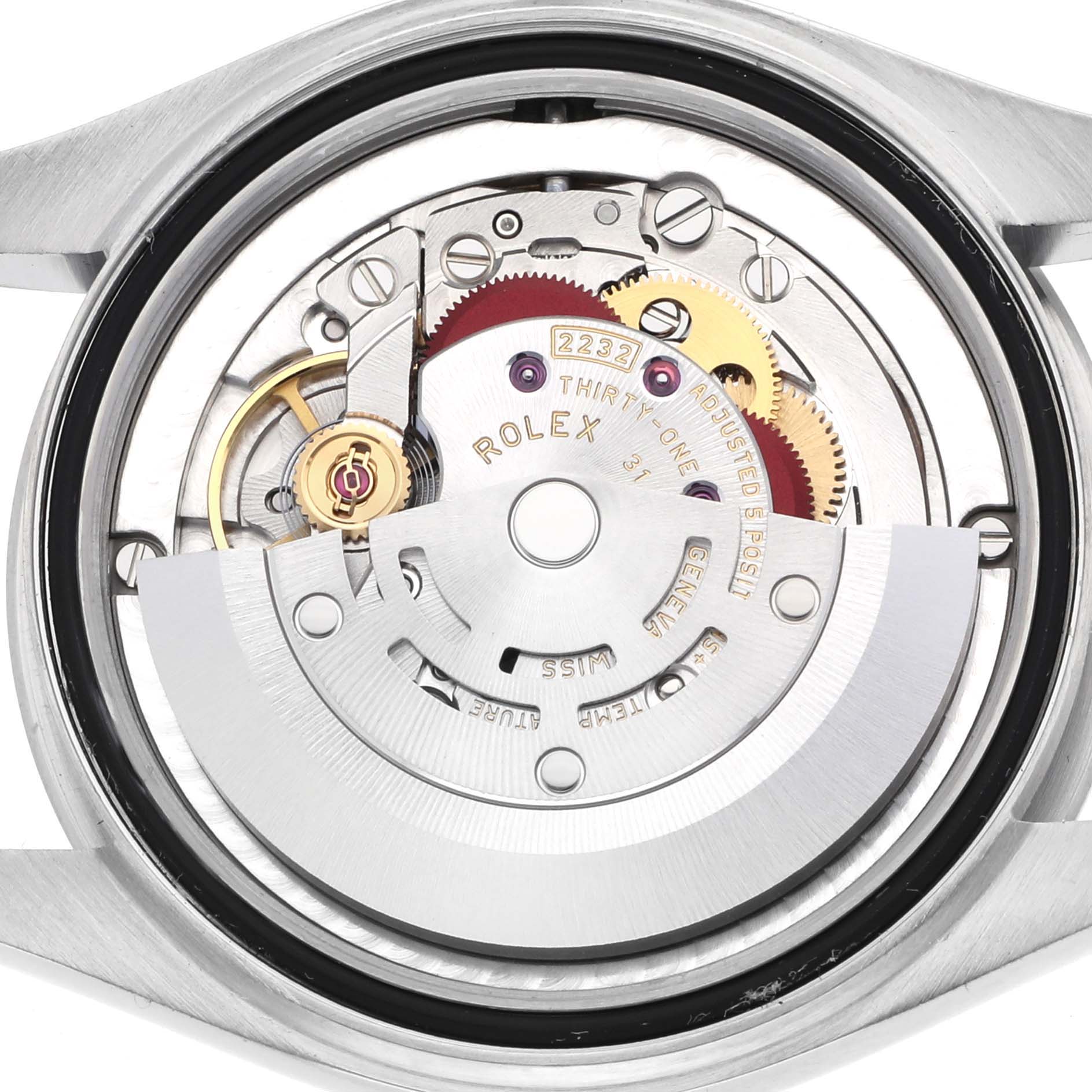 The image shows the case back removed, revealing the Rolex Mid-Size 277200 Women's Stainless Steel Blue Dial watch movement and its components like gears and rotor.