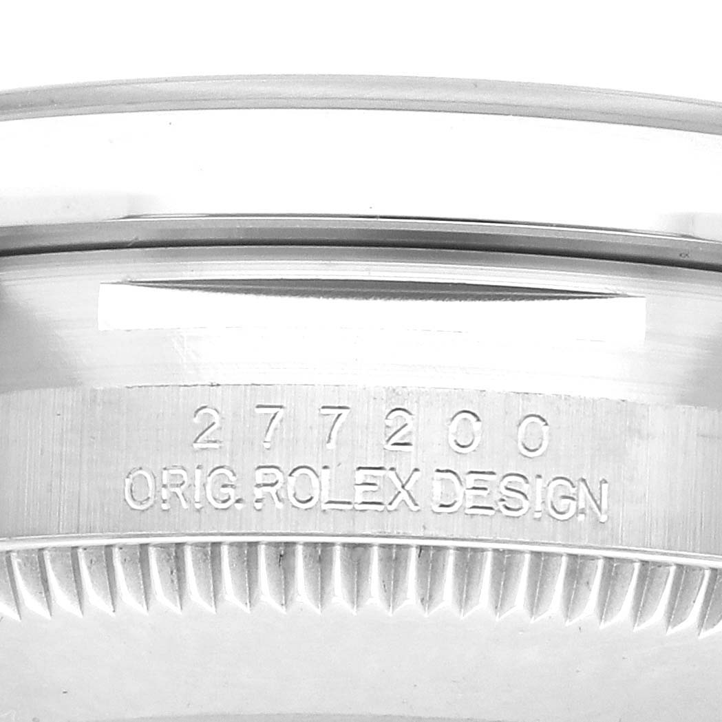 The image shows a close-up of the back of a Rolex Mid-Size 277200 Women's Stainless Steel Blue Dial model, highlighting the model number and original design engraving.