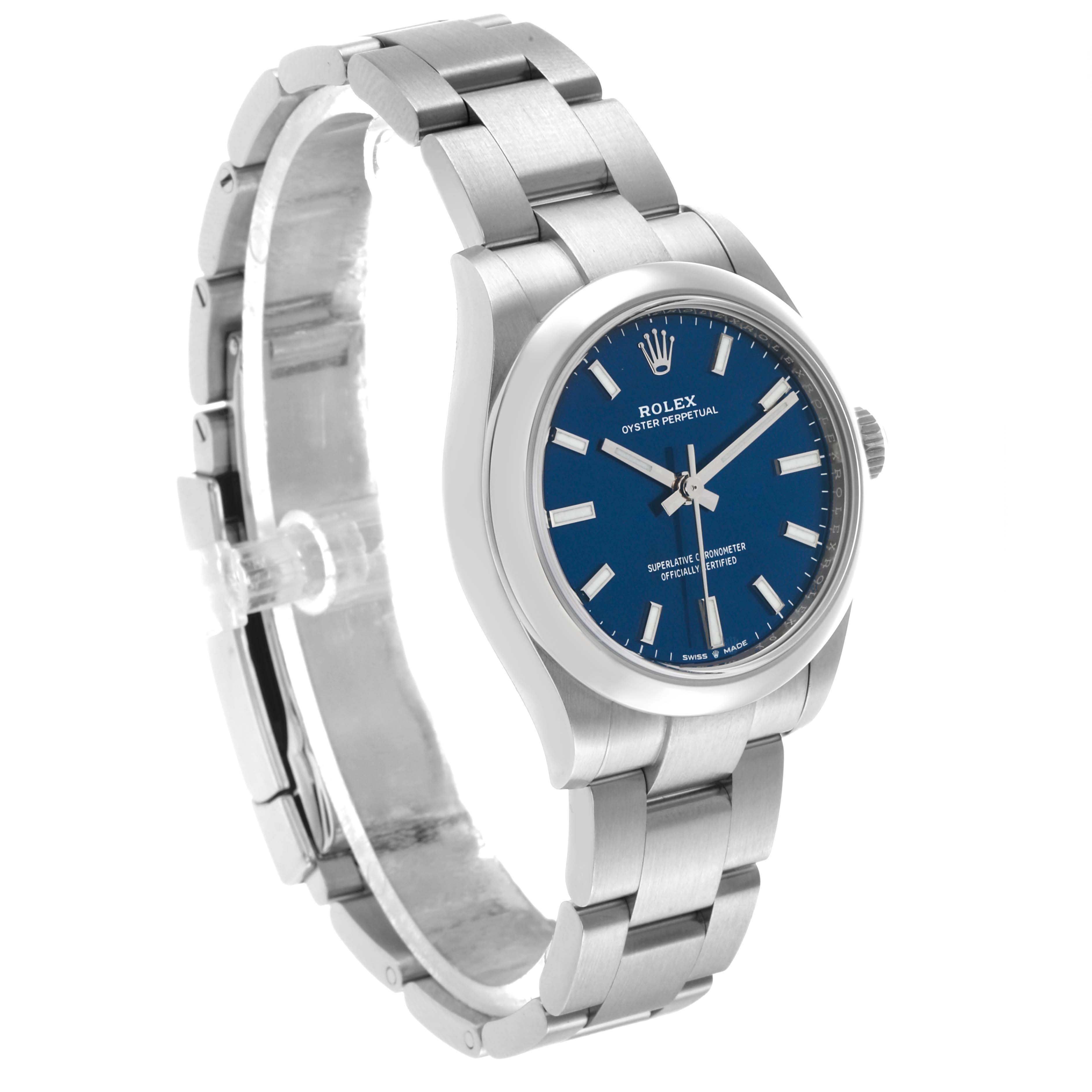 The watch, a Rolex Mid-Size 277200 Women's Stainless Steel Blue Dial Oyster Perpetual, is shown from a front-left angle, highlighting the blue dial and stainless steel bracelet.