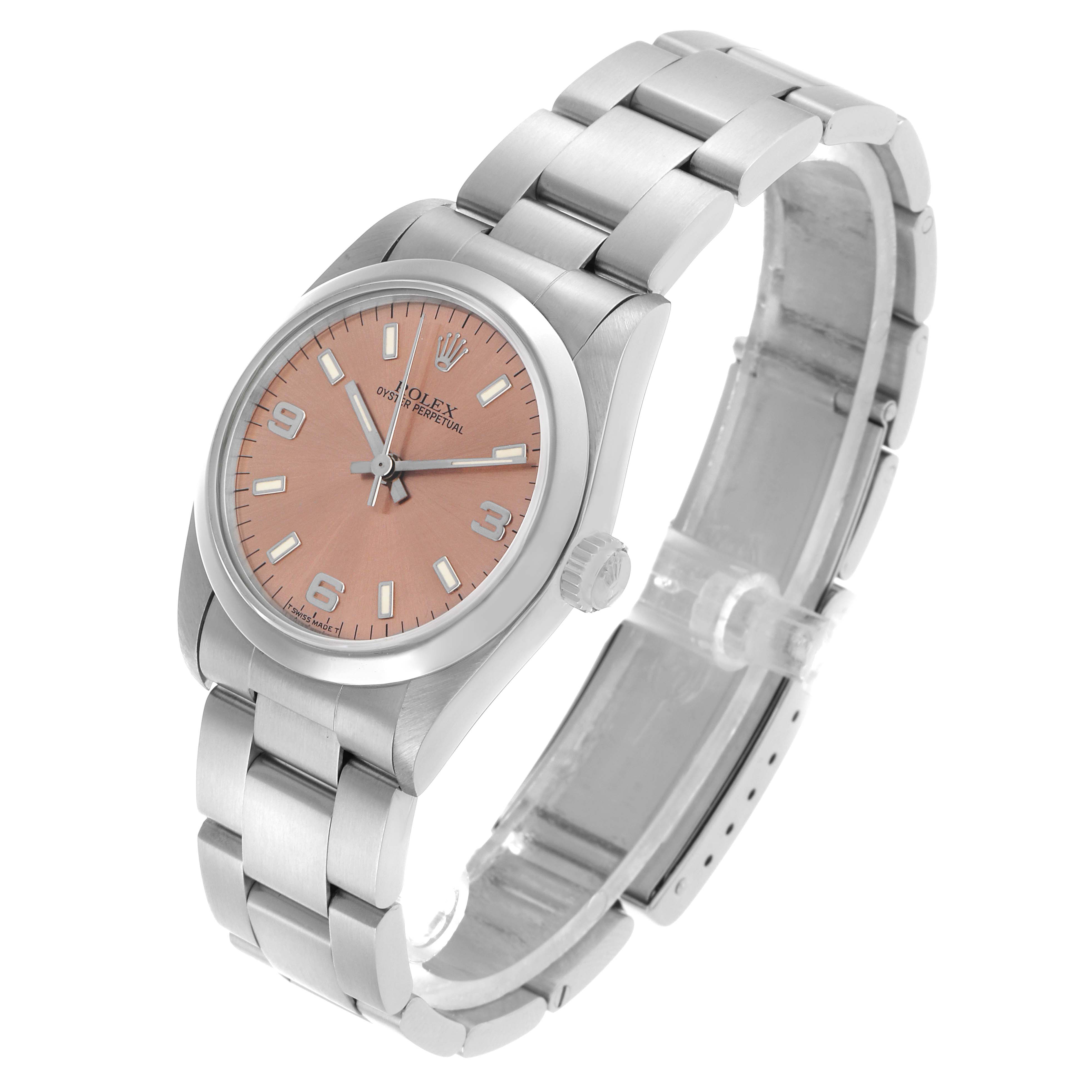 The Rolex Oyster Perpetual 67480 Women's Stainless Steel Pink Dial watch is shown at an angled side view, highlighting the dial, bezel, crown, and bracelet.