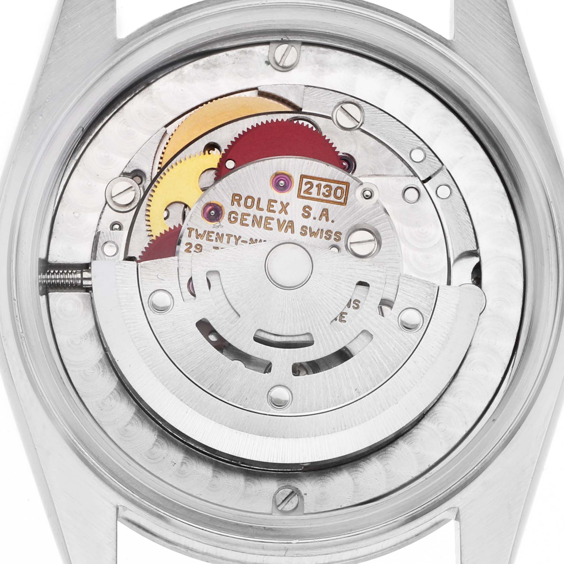 The image shows the movement of a Rolex Oyster Perpetual 67480 Women's Stainless Steel Pink Dial watch from a top-down angle, highlighting its mechanical components.