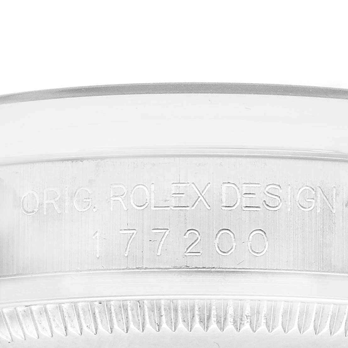 The image shows a close-up of the side of a Rolex Oyster Perpetual 177200 Women's Stainless Steel White Dial watch, highlighting the engraved model number and design details.