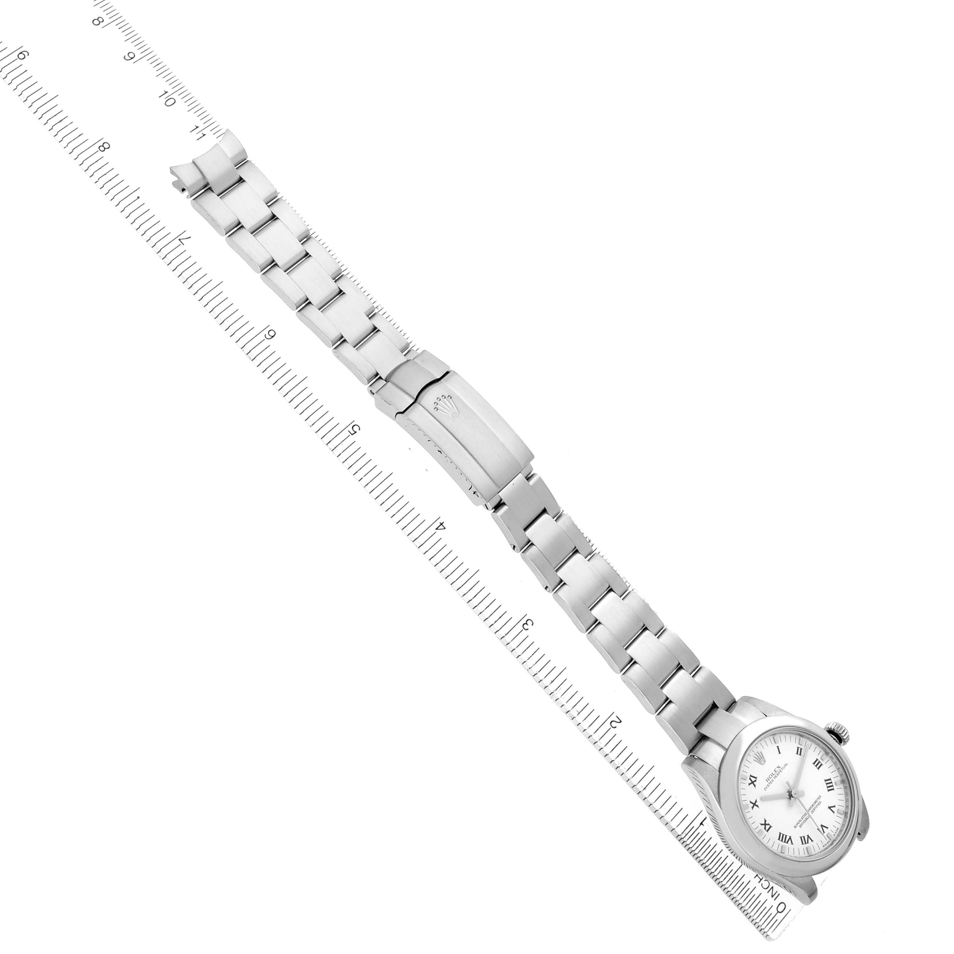 The Rolex Oyster Perpetual 177200 Women's Stainless Steel White Dial watch is displayed diagonally, showing the full bracelet, clasp, and watch face.