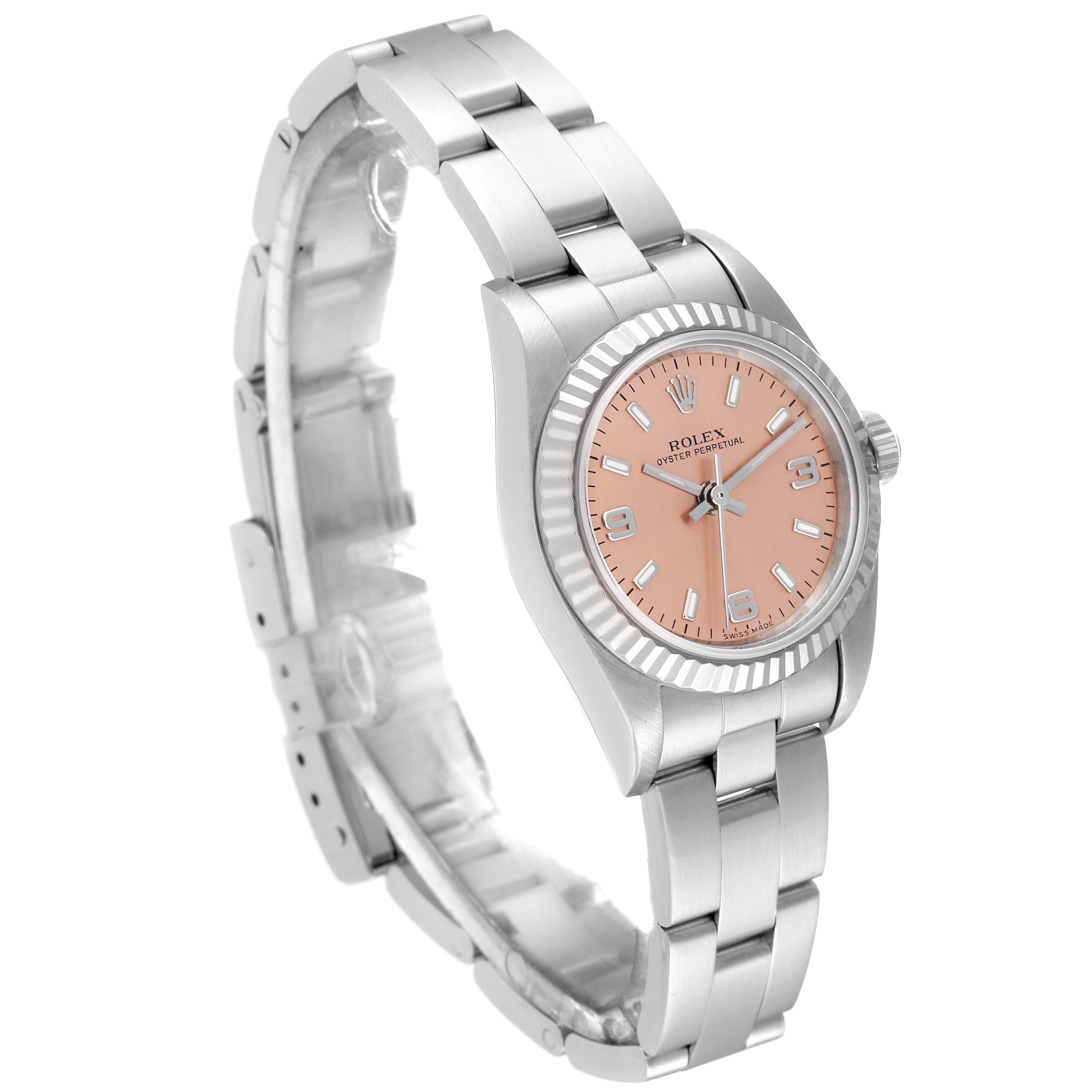 The Rolex Oyster Perpetual 76094 Women
s Stainless Steel Pink Dial 76094 Women
s Stainless Steel Pink Dial watch is shown at a three-quarter angle, displaying its bracelet, bezel, and face.