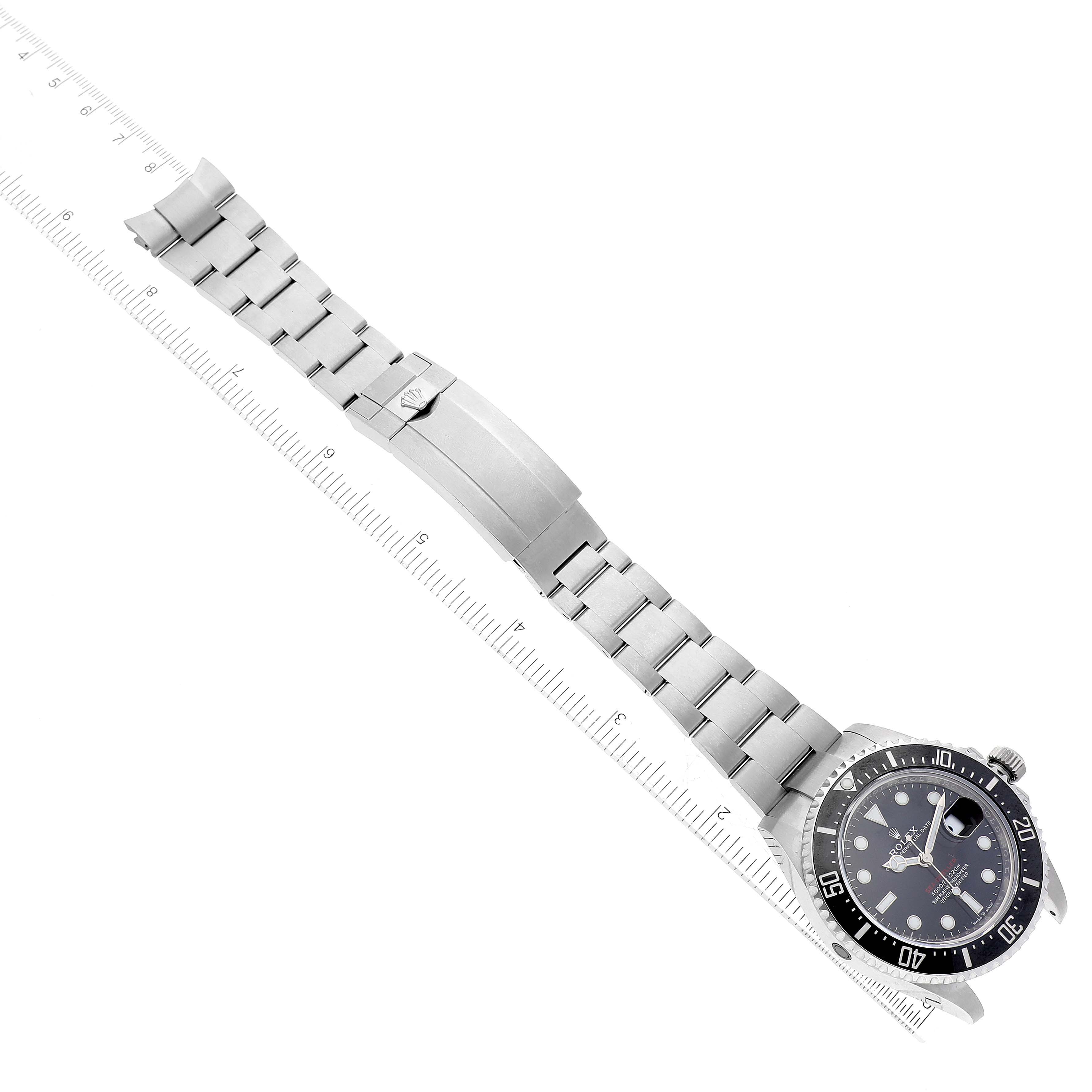 The image shows a top-down view of a Rolex Sea-Dweller 126600 Men
s Stainless Steel Black Dial 126600 Men
s Stainless Steel Black Dial watch, highlighting its face, bezel, and metal bracelet.