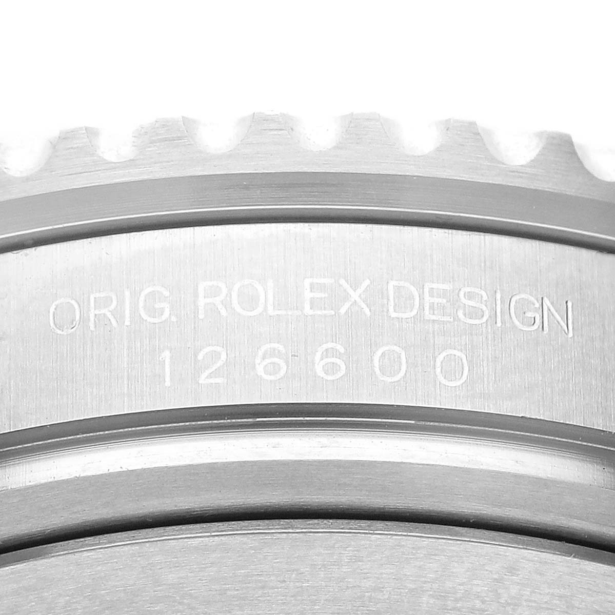 This close-up image shows the engraved caseback and edge of the bezel of the Rolex Sea-Dweller 126600 Men
s Stainless Steel Black Dial 126600 Men
s Stainless Steel Black Dial model.