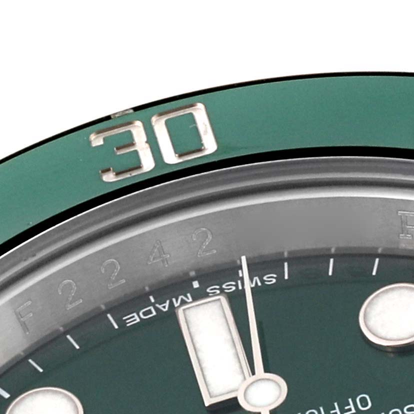 This close-up shows part of the bezel and dial of a Rolex Submariner 116610LV Men's Stainless Steel Green Dial 116610LV Men's Stainless Steel Green Dial watch, featuring the "30" marker and "SWISS MADE" text.