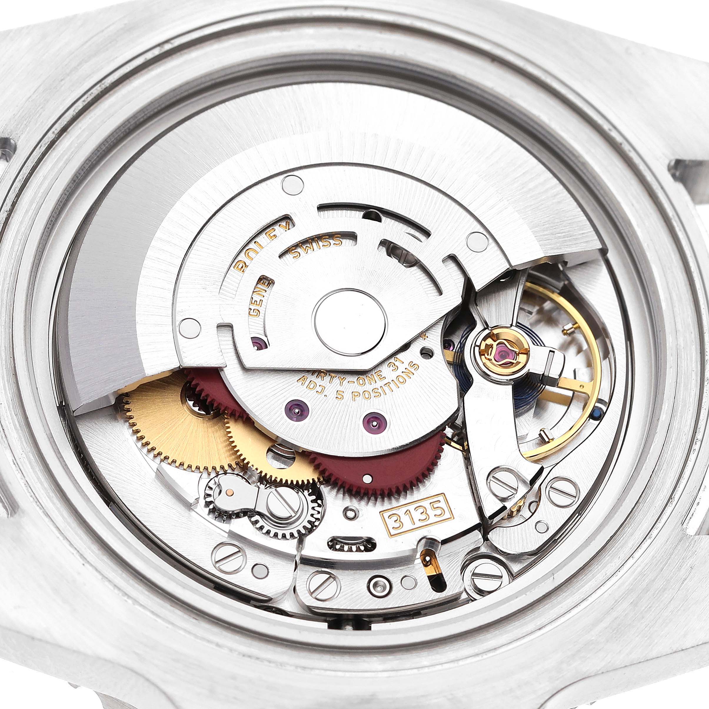 This image shows a close-up view of the movement mechanism for a Rolex Submariner 116610LV Men's Stainless Steel Green Dial 116610LV Men's Stainless Steel Green Dial watch.