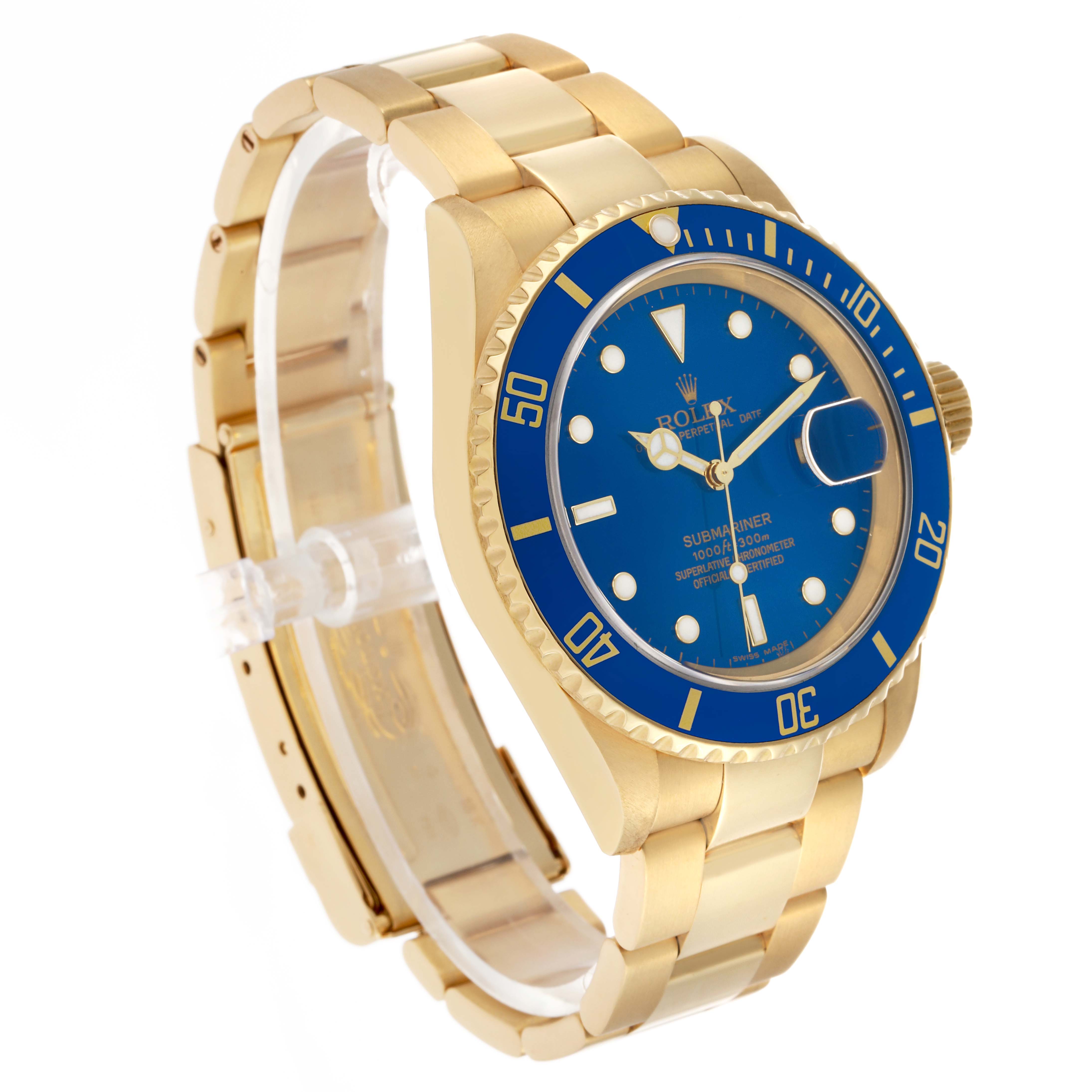 The Rolex Submariner 16618 Men's Yellow Gold Blue Dial watch is shown at a slight angle, displaying the gold bracelet, blue bezel, and face with visible crown.
