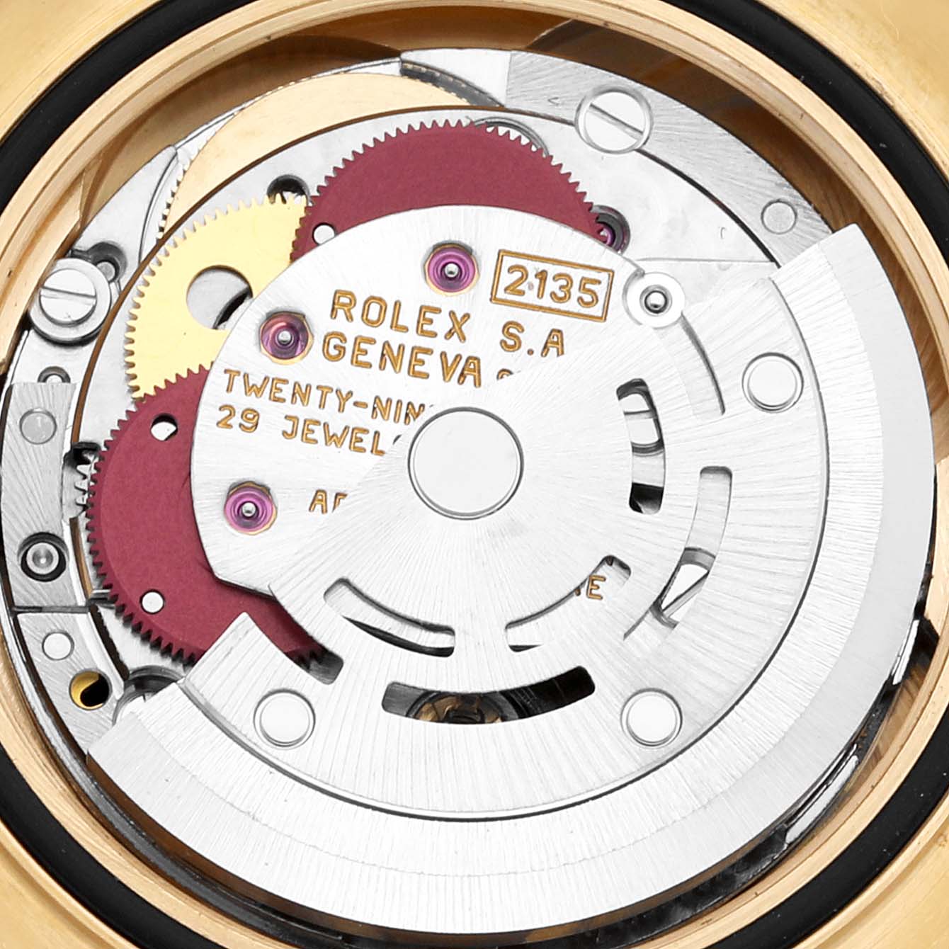 The image shows the intricate inner mechanics of the Rolex Yacht-Master 69628 Women's Yellow Gold White Dial 69628 Women's Yellow Gold White Dial watch, highlighting the rotor and movement parts.