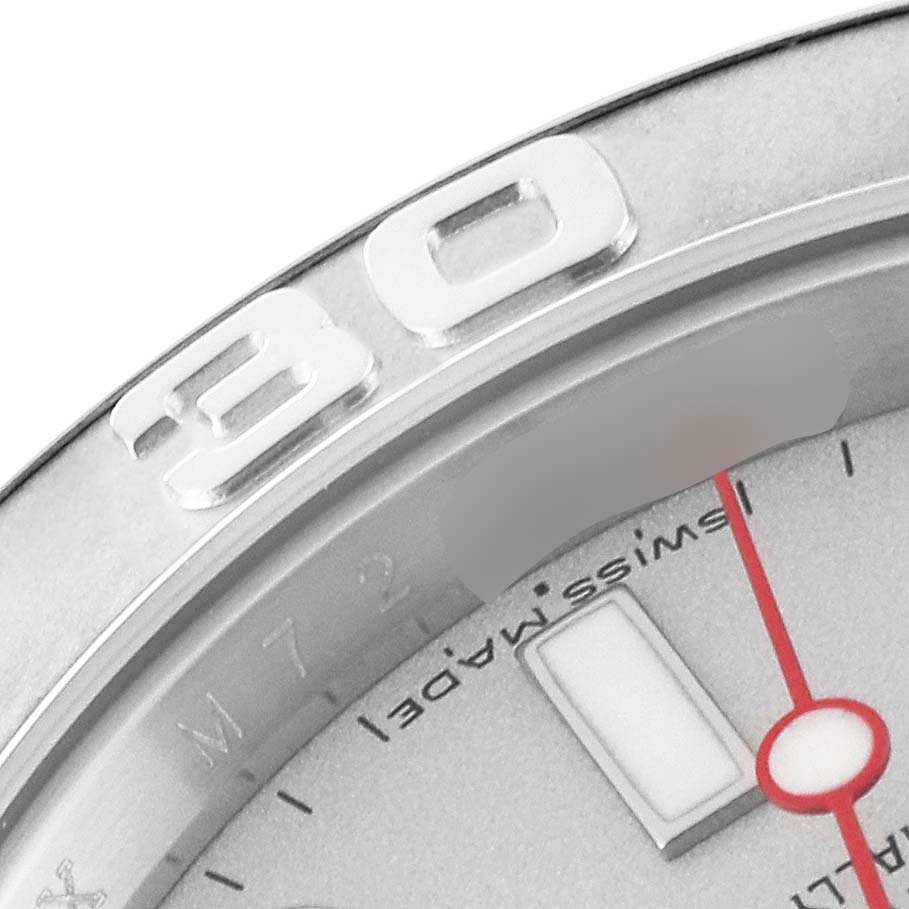 This close-up of a Rolex Yacht-Master 16622 Men's Stainless Steel Silver Dial 16622 Men's Stainless Steel Silver Dial watch shows the bezel with the "30" marker and part of the dial with "Swiss Made."