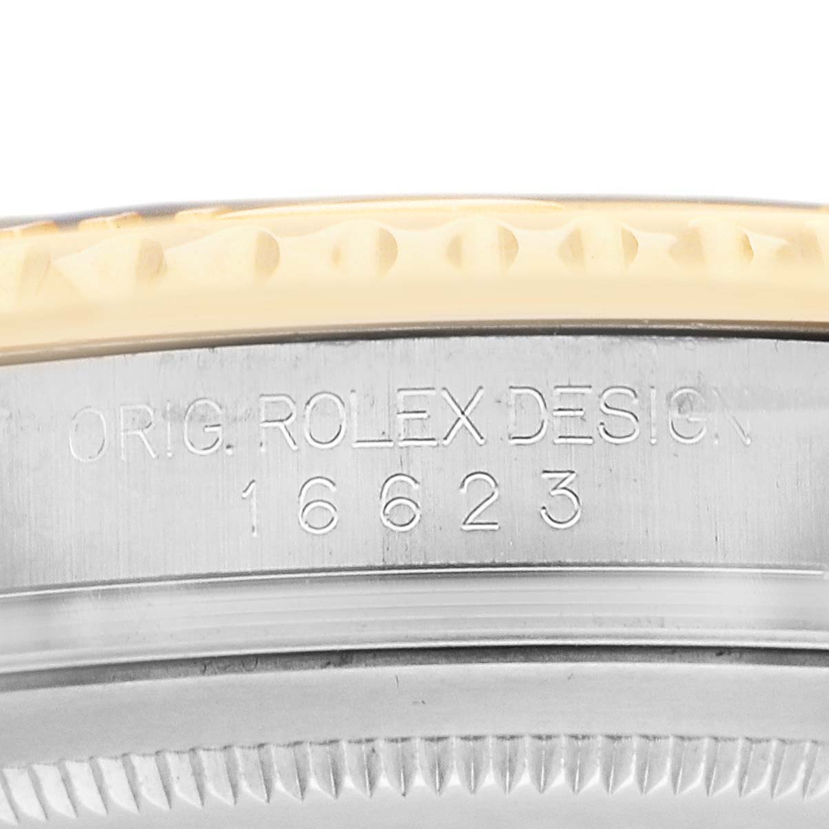 The image shows a close-up of the side view of a Rolex Yacht-Master 16623 Men's Steel and Gold (two tone) White Dial watch case with engraved design and model number.