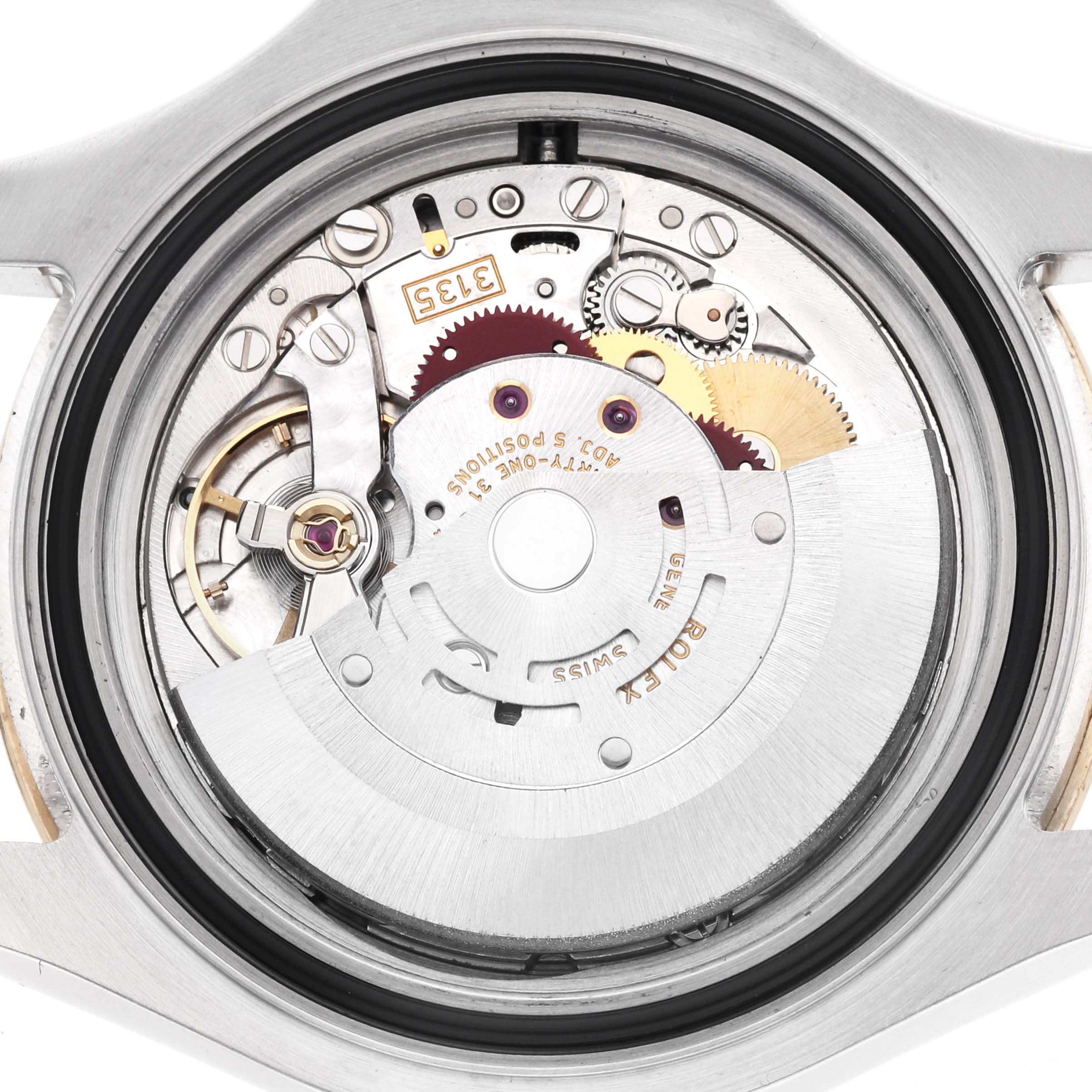 The image shows the movement mechanism of a Rolex Yacht-Master 16623 Men's Steel and Gold (two tone) White Dial watch from a back angle, revealing gears and components.