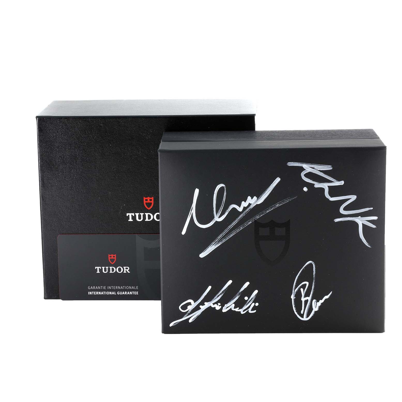 The image shows the Tudor Heritage Black Bay M79470 Men
s Stainless Steel Black Dial M79470 Men
s Stainless Steel Black Dial watch packaging and international guarantee card.