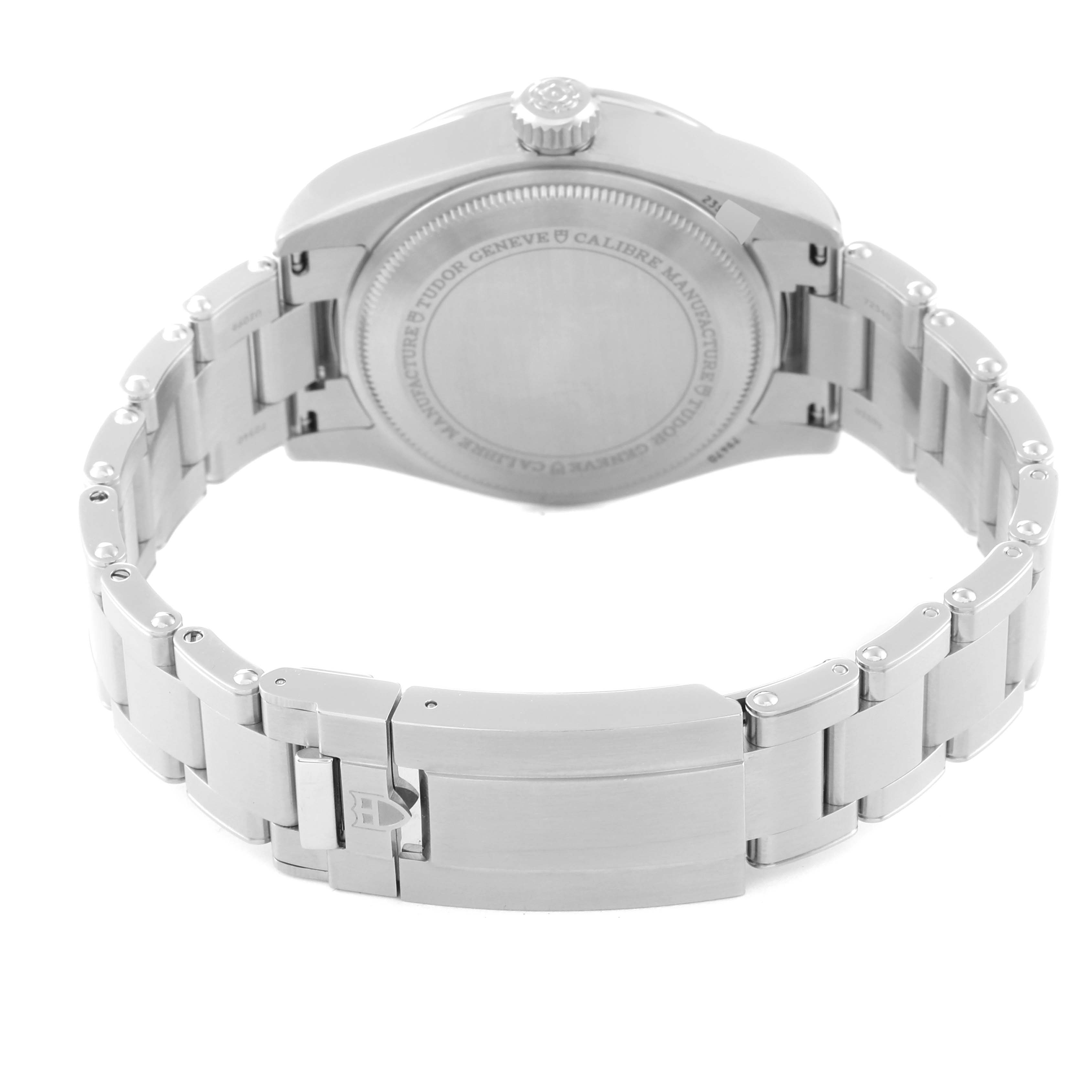 The image displays the rear view of the Tudor Heritage Black Bay M79470 Men
s Stainless Steel Black Dial M79470 Men
s Stainless Steel Black Dial watch, focusing on the case back and stainless-steel bracelet.