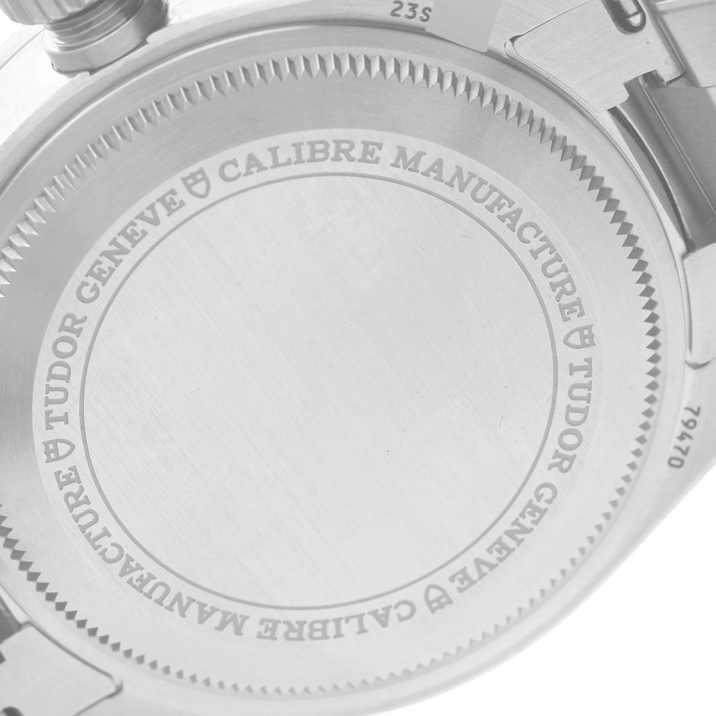 The image shows the case back of the Tudor Heritage Black Bay M79470 Men
s Stainless Steel Black Dial M79470 Men
s Stainless Steel Black Dial watch from a close-up angle, highlighting the engraved text.