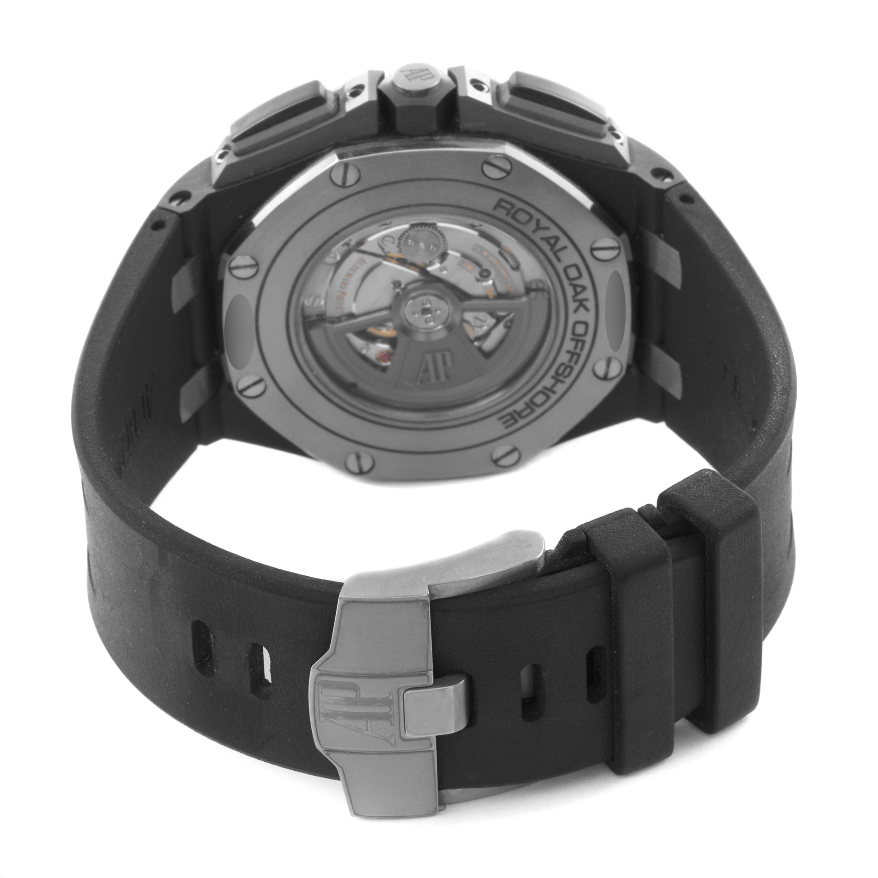 The image shows the back of the Audemars Piguet Royal Oak Offshore 26405CE.OO.A002CA.01 Men's Ceramic Grey Dial 26405CE.OO.A002CA.01 Men's Ceramic Grey Dial watch, highlighting the case back and strap clasp.