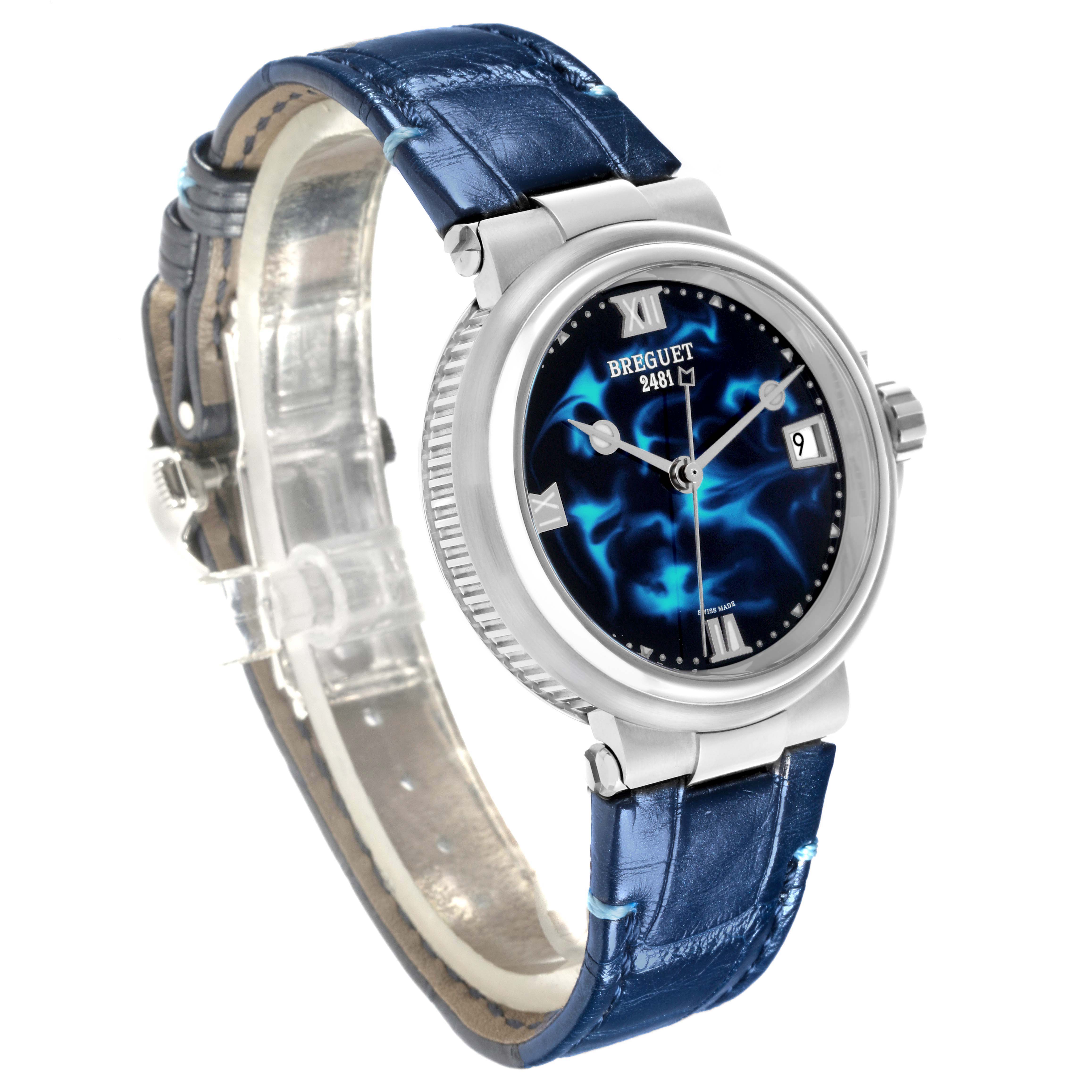 The Breguet 9517ST/E2/984 Women's Stainless Steel Blue Dial Marine Automatic 9517ST watch is shown at an angle highlighting the blue dial, bezel, and blue strap.