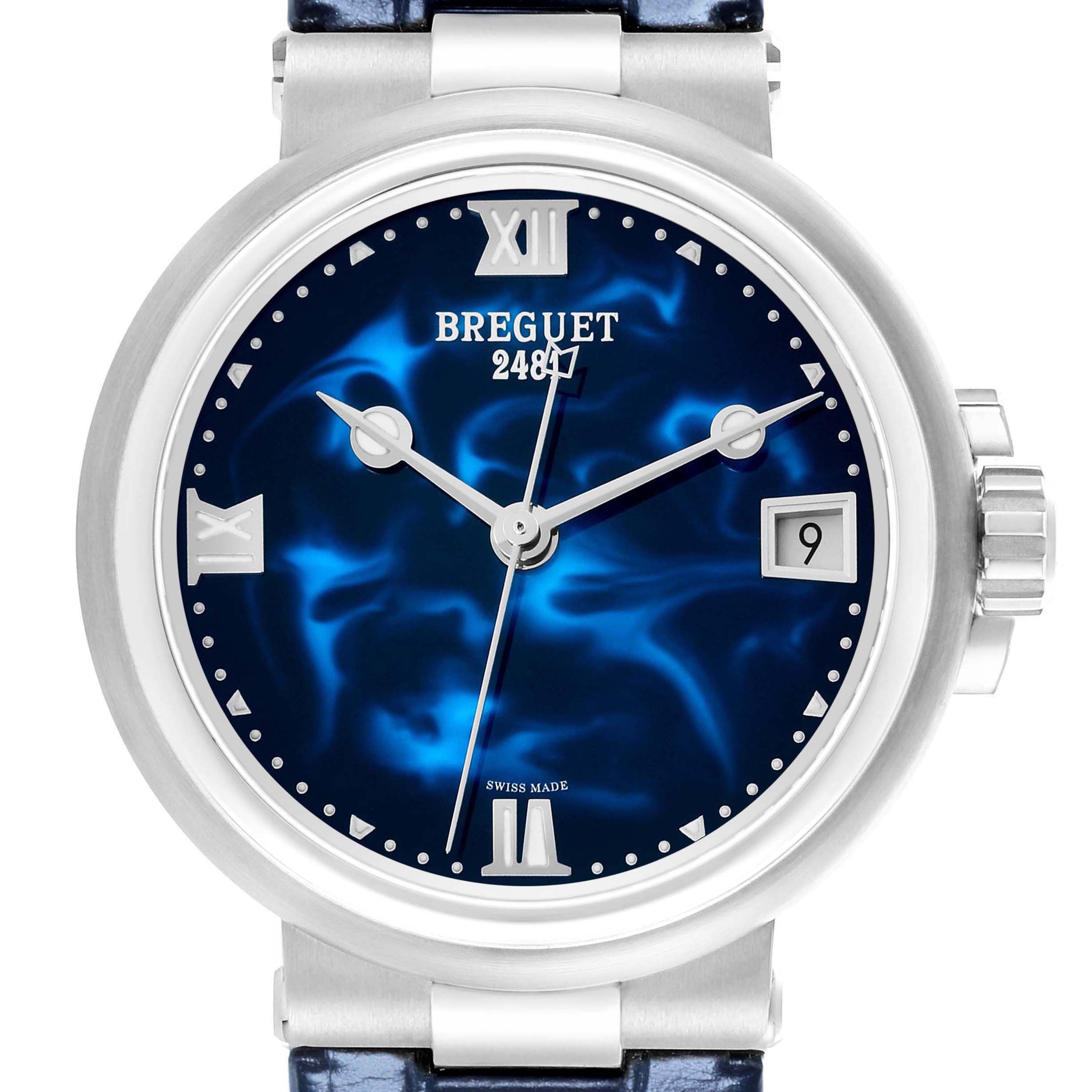 The image shows a frontal view of the Breguet Marine 9517ST/E2/984 Men's Stainless Steel Blue Dial watch, highlighting its blue dial, Roman numerals, and crown.