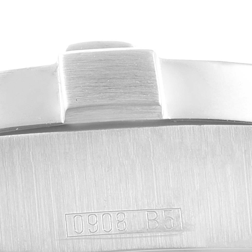 This close-up image shows part of the case back and crown of the Breitling Superocean A17390 Men's Stainless Steel Black Dial A17390 Men's Stainless Steel Black Dial watch, featuring the marking "0908 B5."