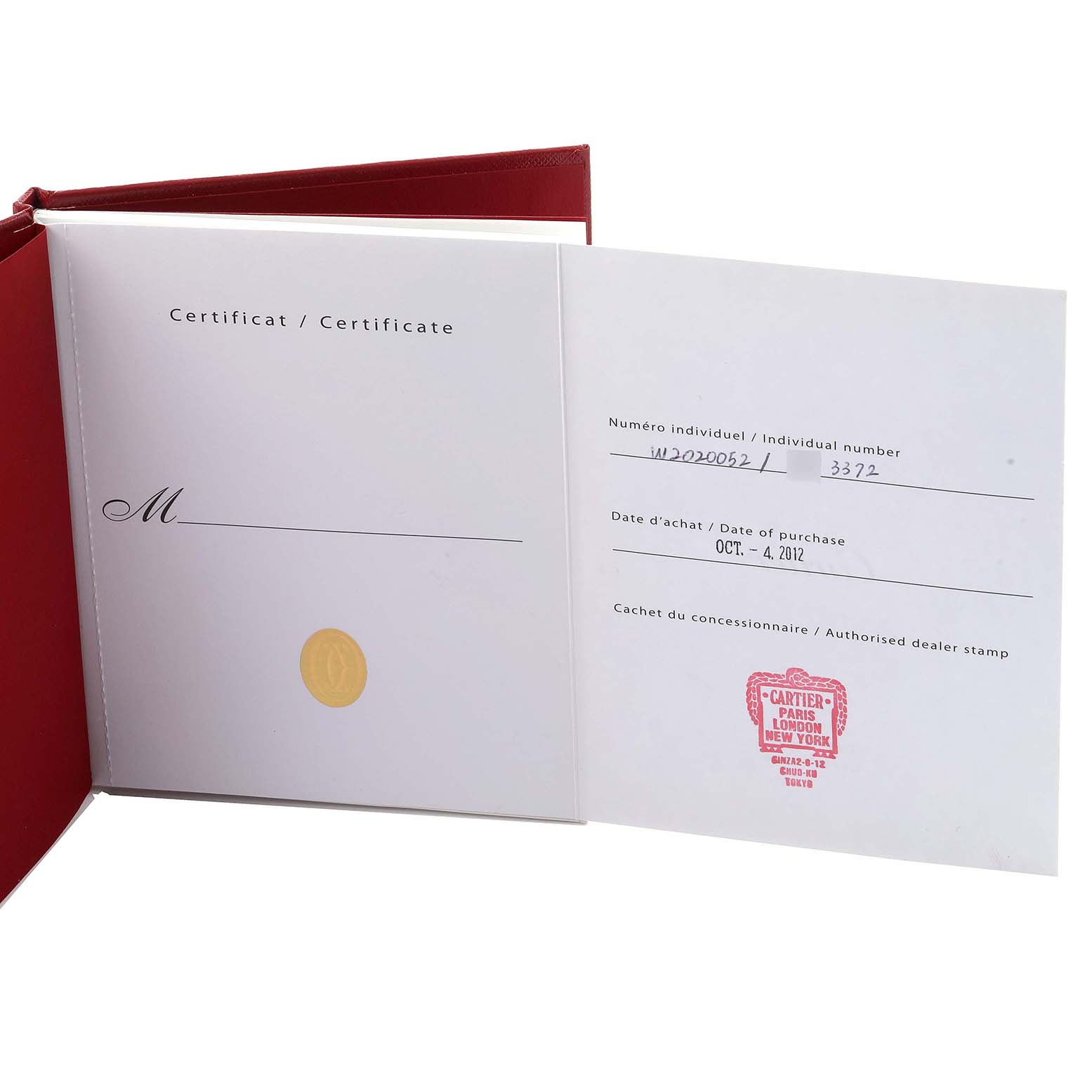 The image shows the certificate and warranty booklet for a Cartier Santos W2020052 Men's Titanium Transparent Dial W2020052 Men's Titanium Transparent Dial watch, opened at an angle.