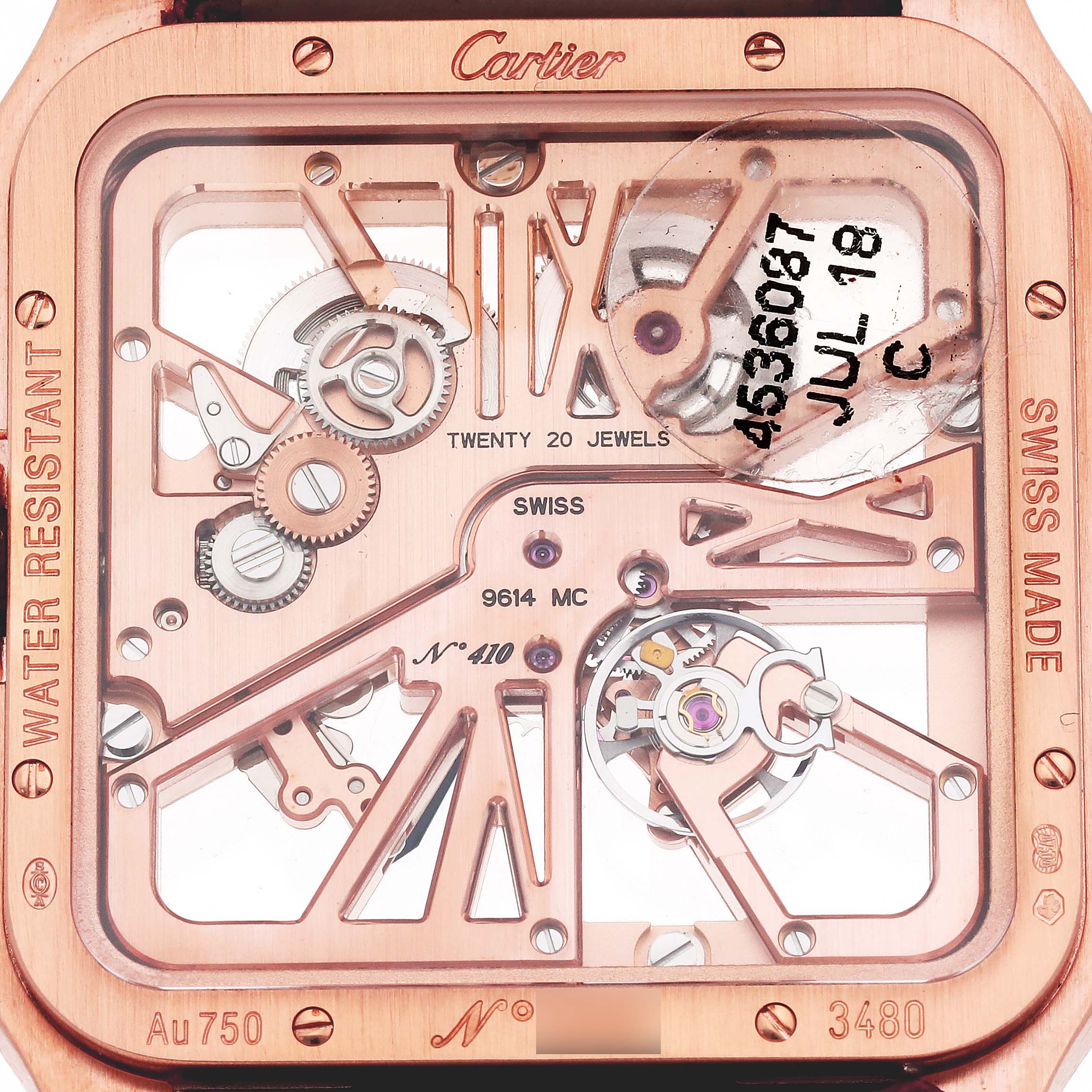 The image shows the back view of a Cartier Santos W2020057 Men's Rose Gold Transparent Dial W2020057 Men's Rose Gold Transparent Dial watch, highlighting its intricate mechanical movement.