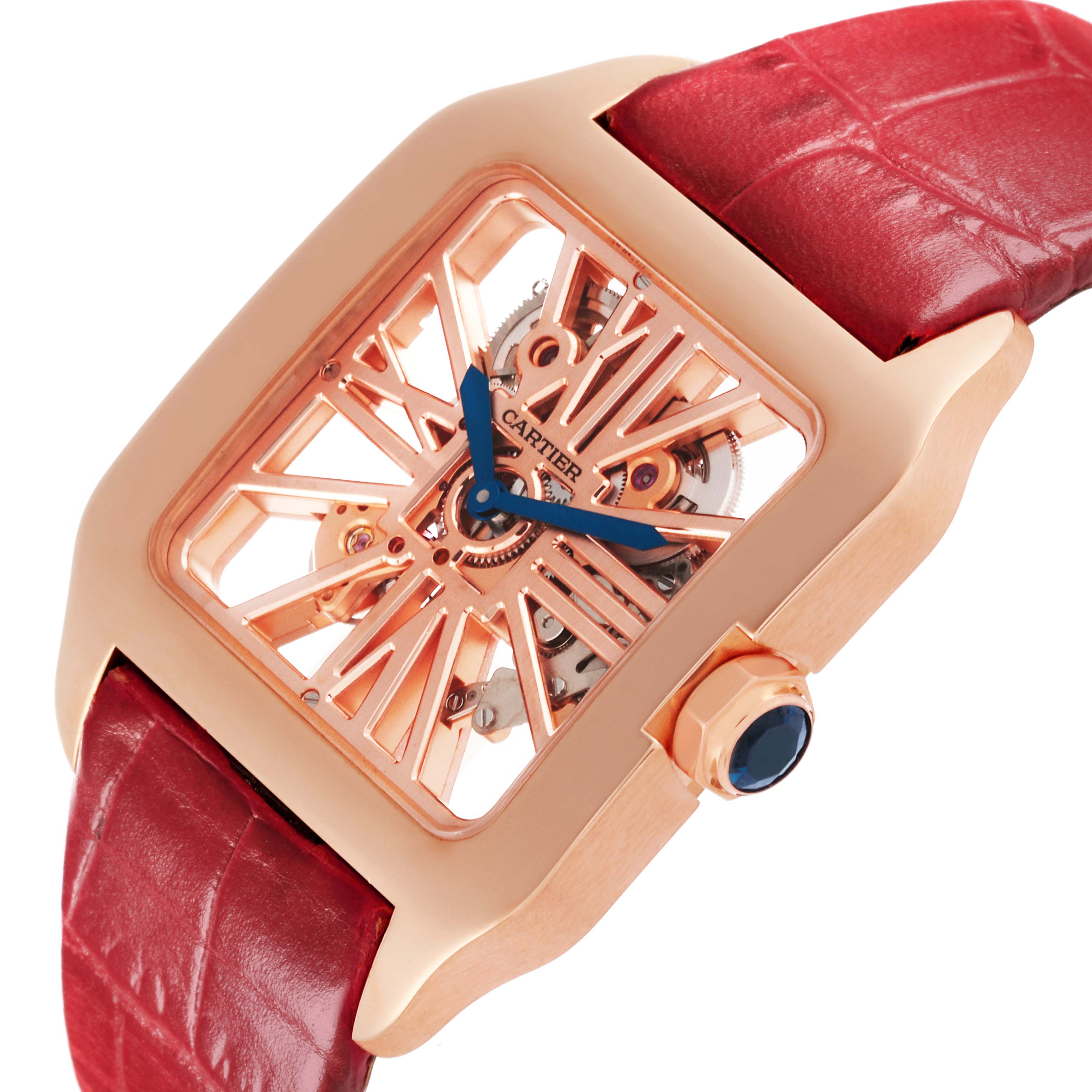 The Cartier Santos W2020057 Men's Rose Gold Transparent Dial W2020057 Men's Rose Gold Transparent Dial watch is shown at an angled view, highlighting its rose gold skeleton dial and red leather strap.