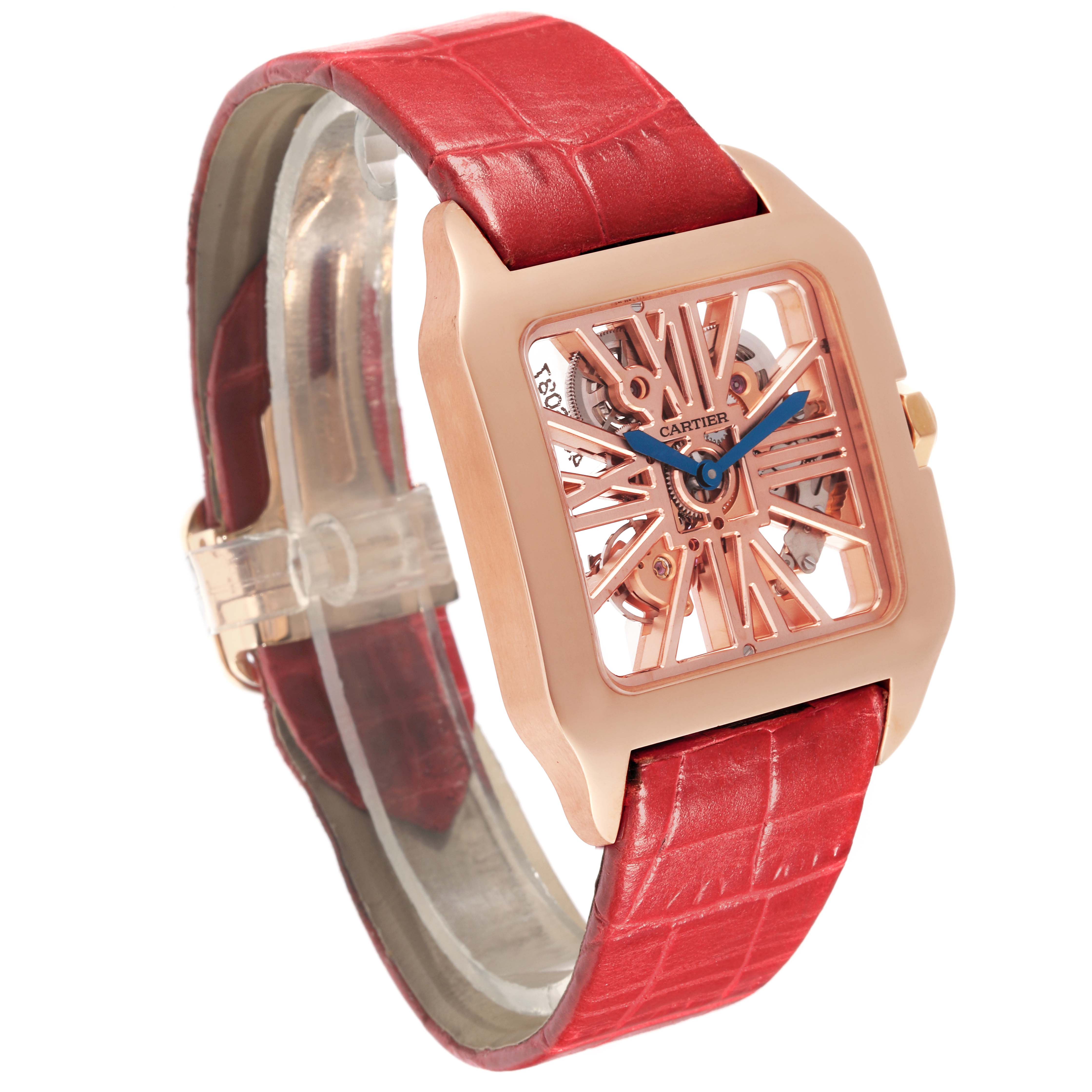 The Cartier Santos W2020057 Men's Rose Gold Transparent Dial W2020057 Men's Rose Gold Transparent Dial watch is shown at an angle highlighting its skeleton dial, red strap, and rectangular case.