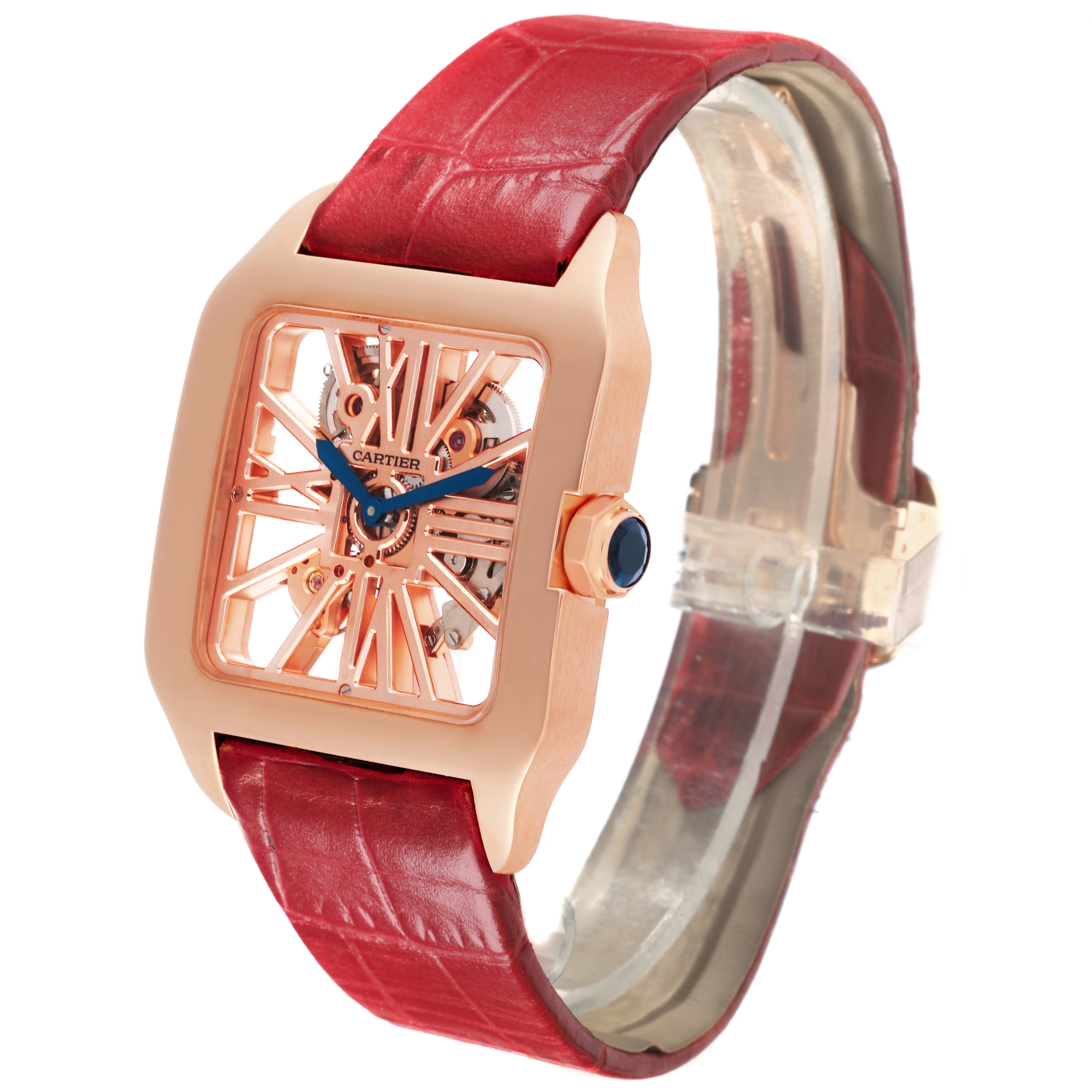 The Cartier Santos W2020057 Men's Rose Gold Transparent Dial W2020057 Men's Rose Gold Transparent Dial watch is shown at an angle highlighting the rose gold case, skeleton dial, and red leather strap.