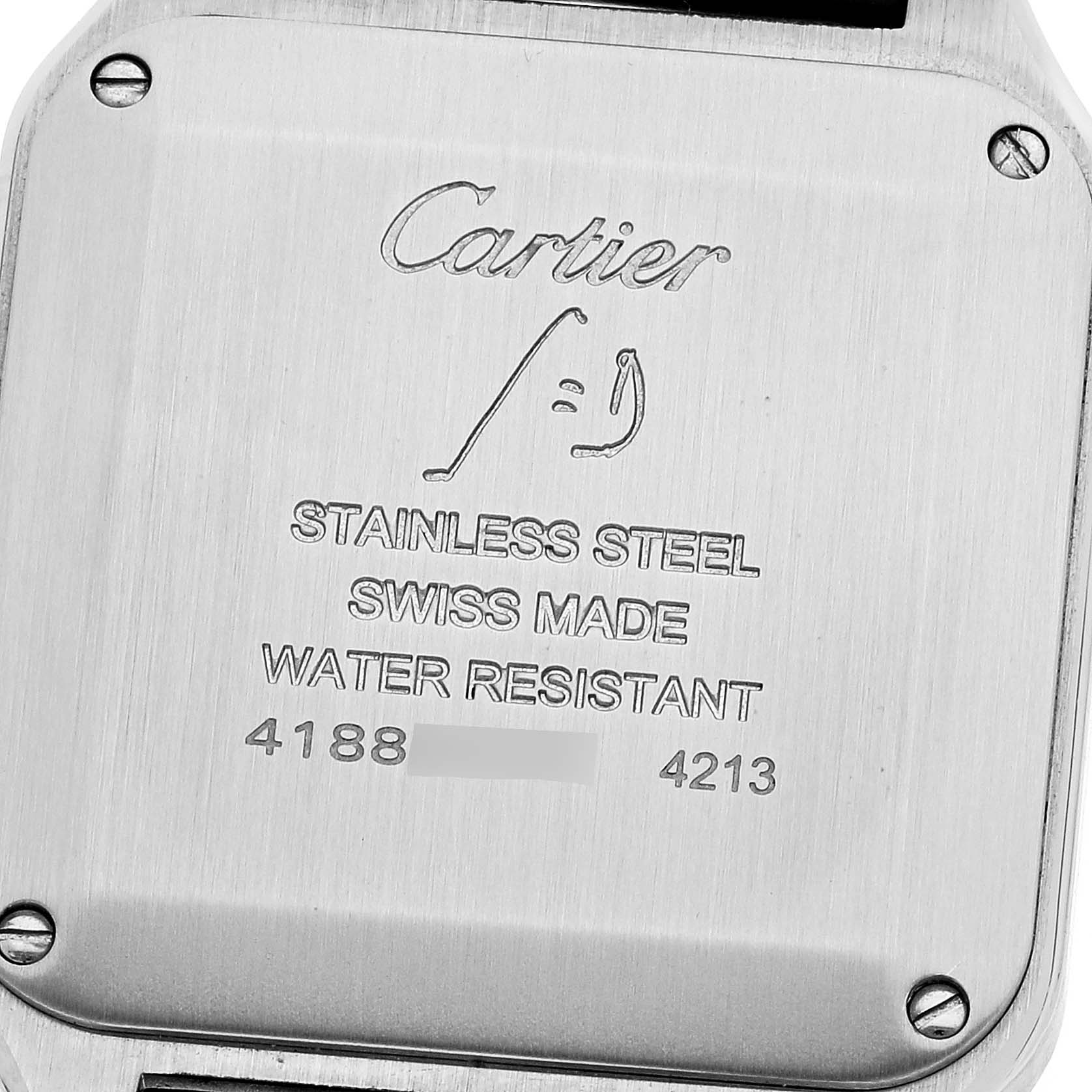 The image shows the case back of a Cartier Santos WSSA0023 Women
s Stainless Steel Silver Dial WSSA0023 Women
s Stainless Steel Silver Dial watch, highlighting inscriptions and screws.